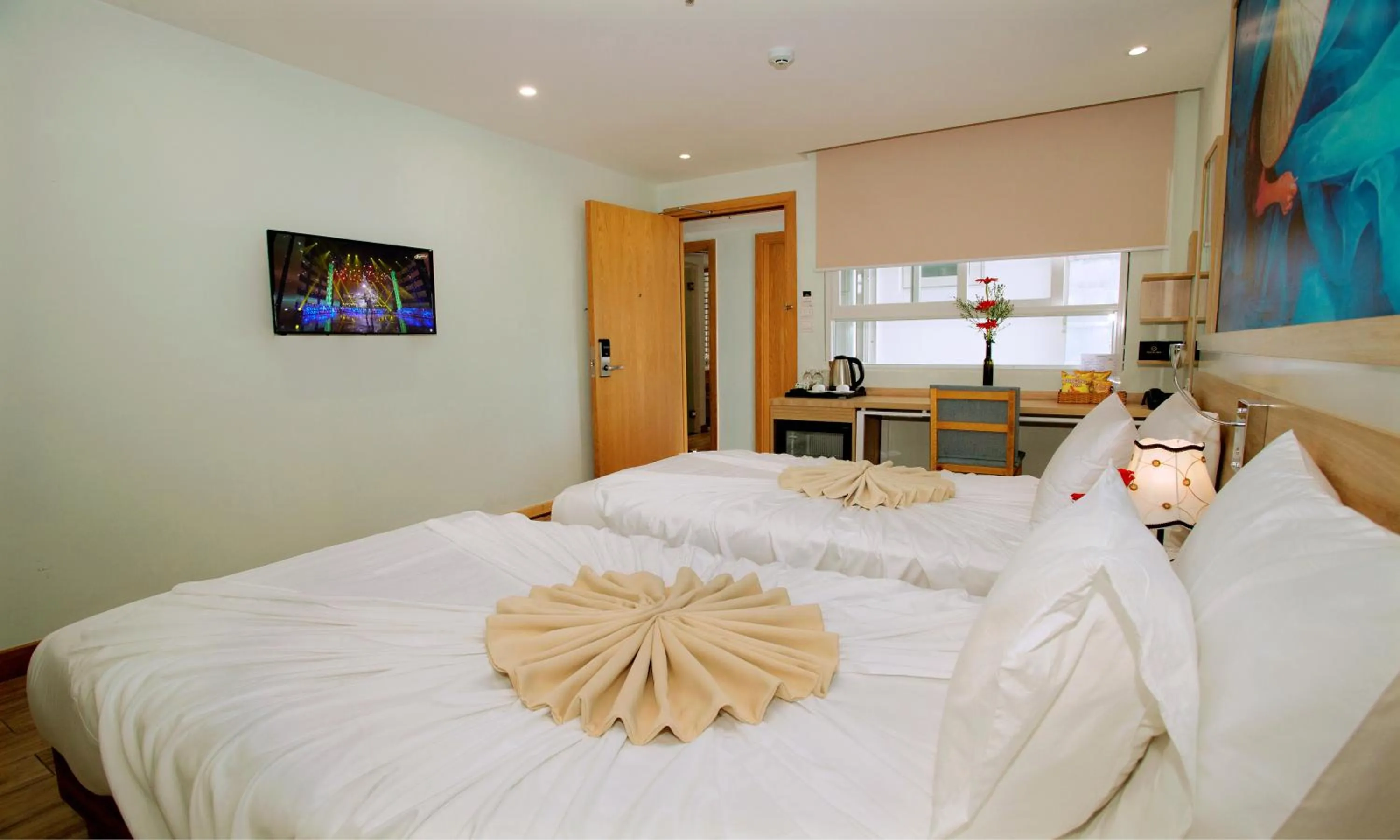 Bed in Royal HPM Hotel