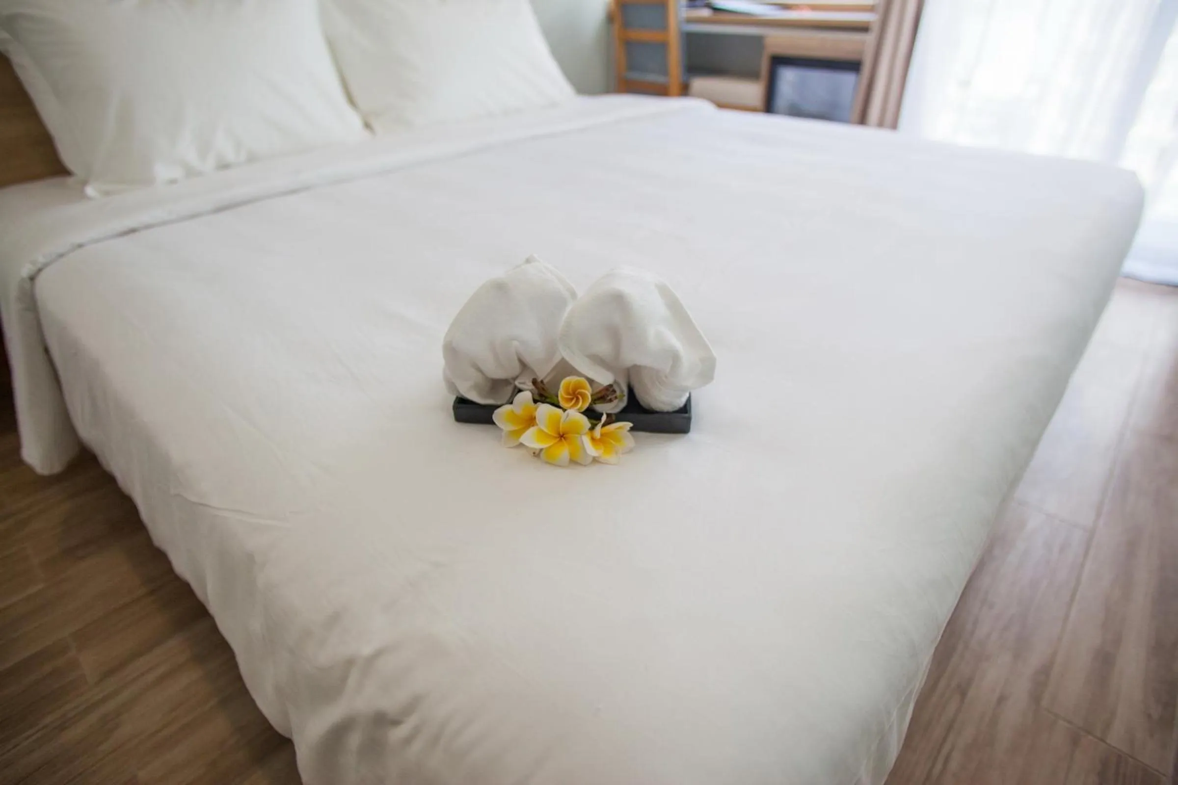 Bed in Royal HPM Hotel