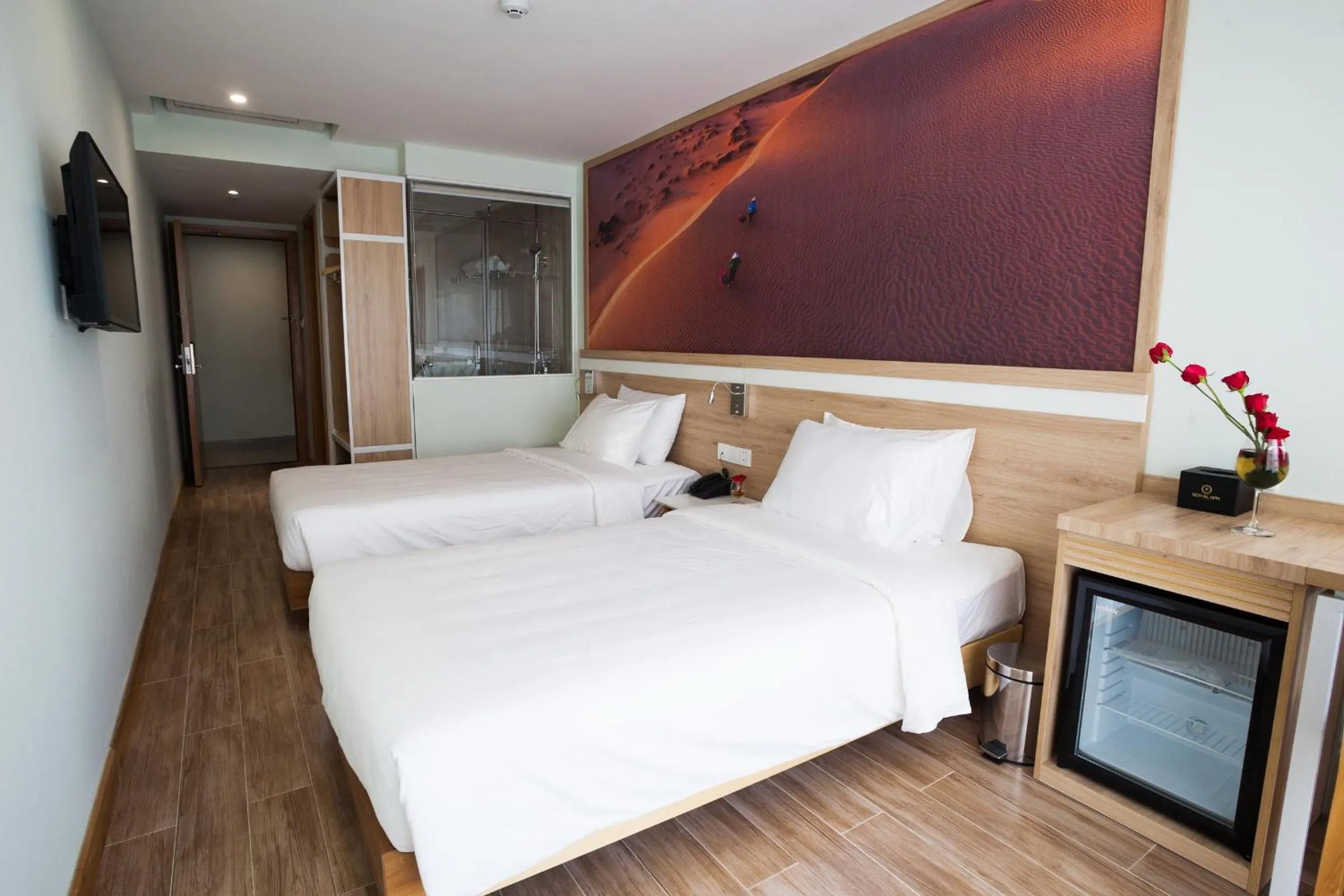 Bed in Royal HPM Hotel