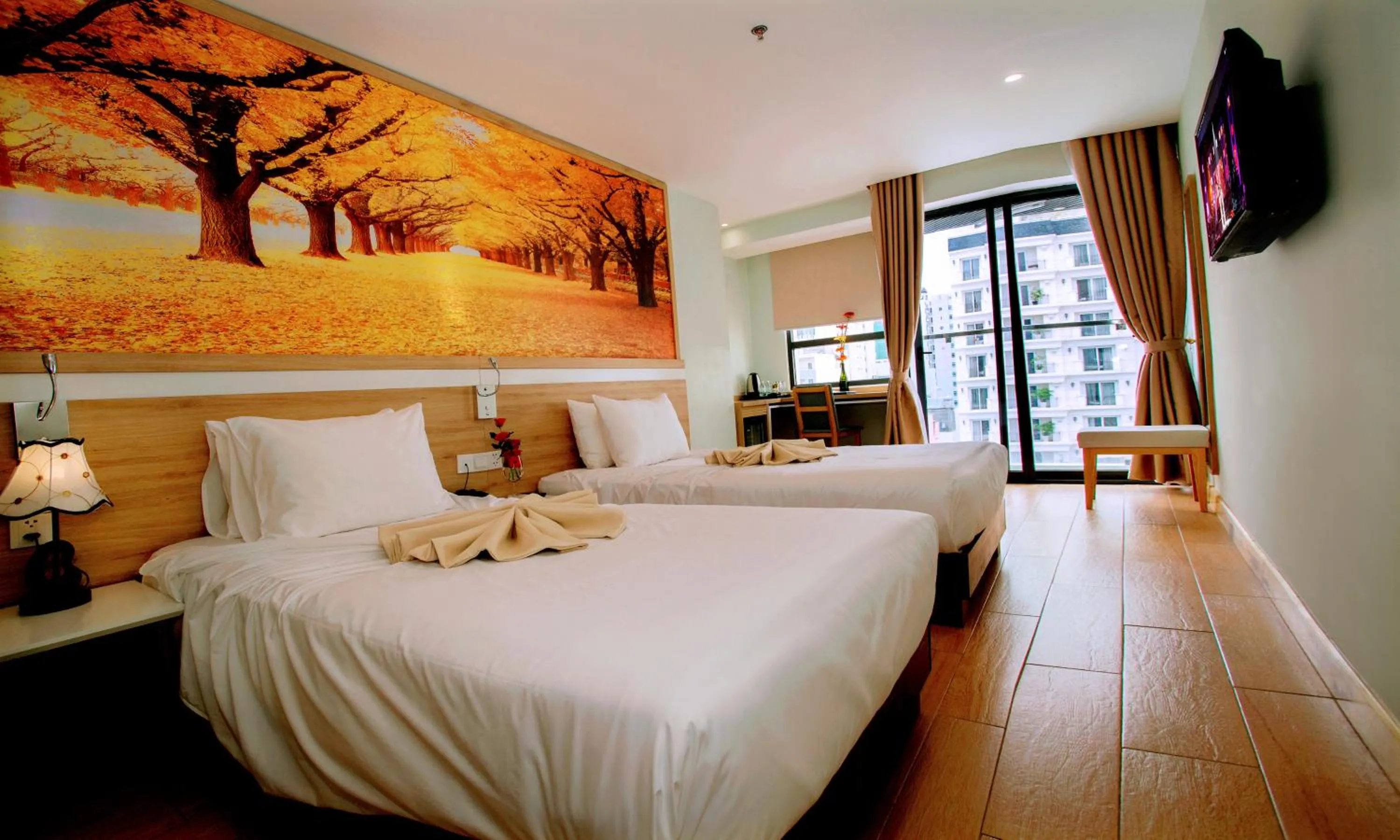 Bed in Royal HPM Hotel