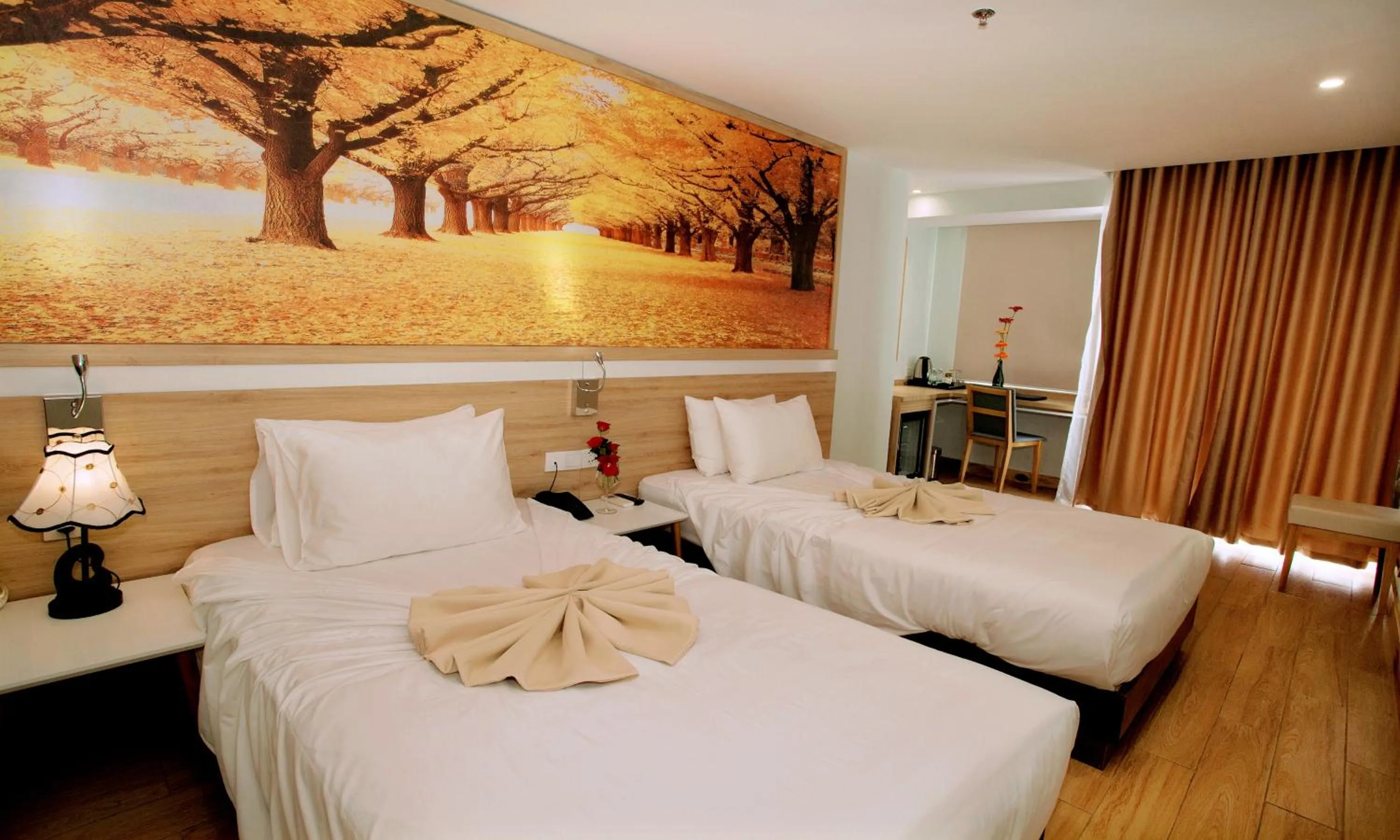 Bed in Royal HPM Hotel