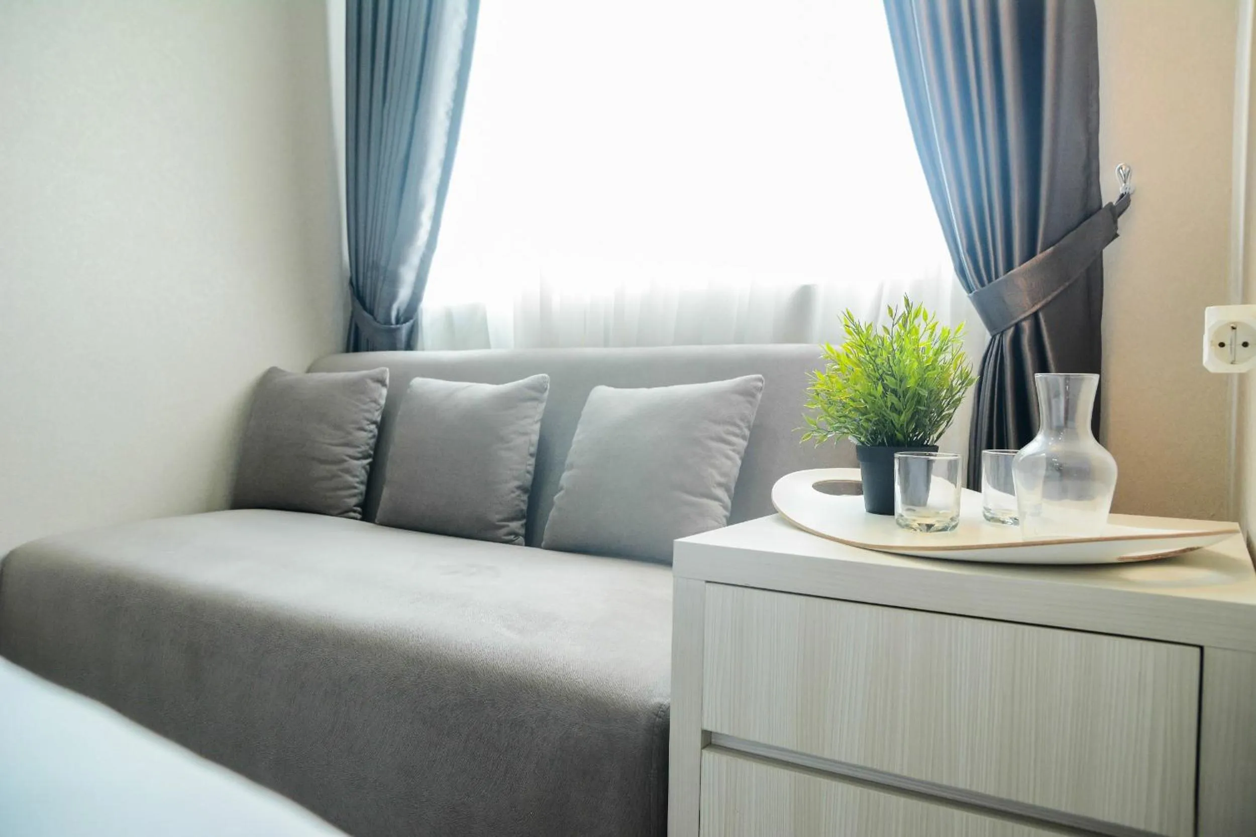 Living room in Sophisticated Studio at The Oasis Apartment By Travelio