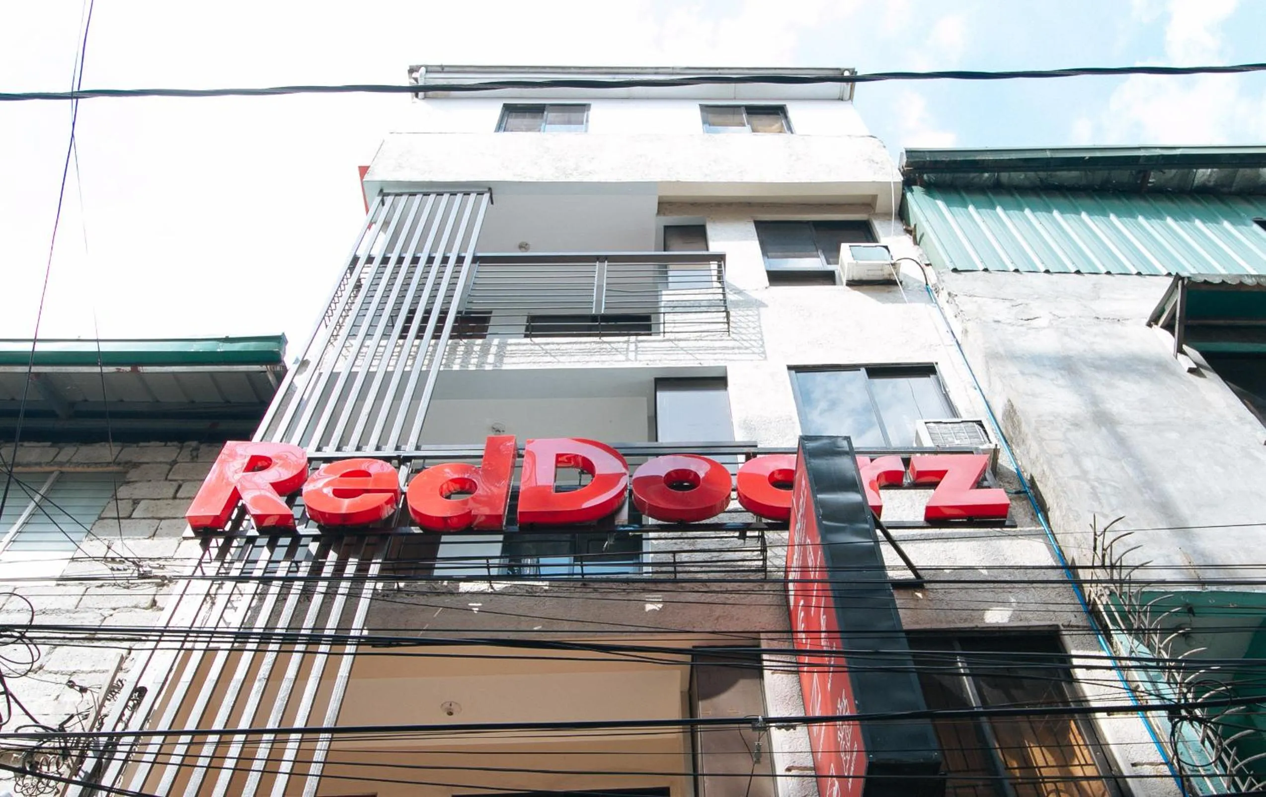 Property logo or sign in RedDoorz at DBuilders Rooms Ph2 Taguig