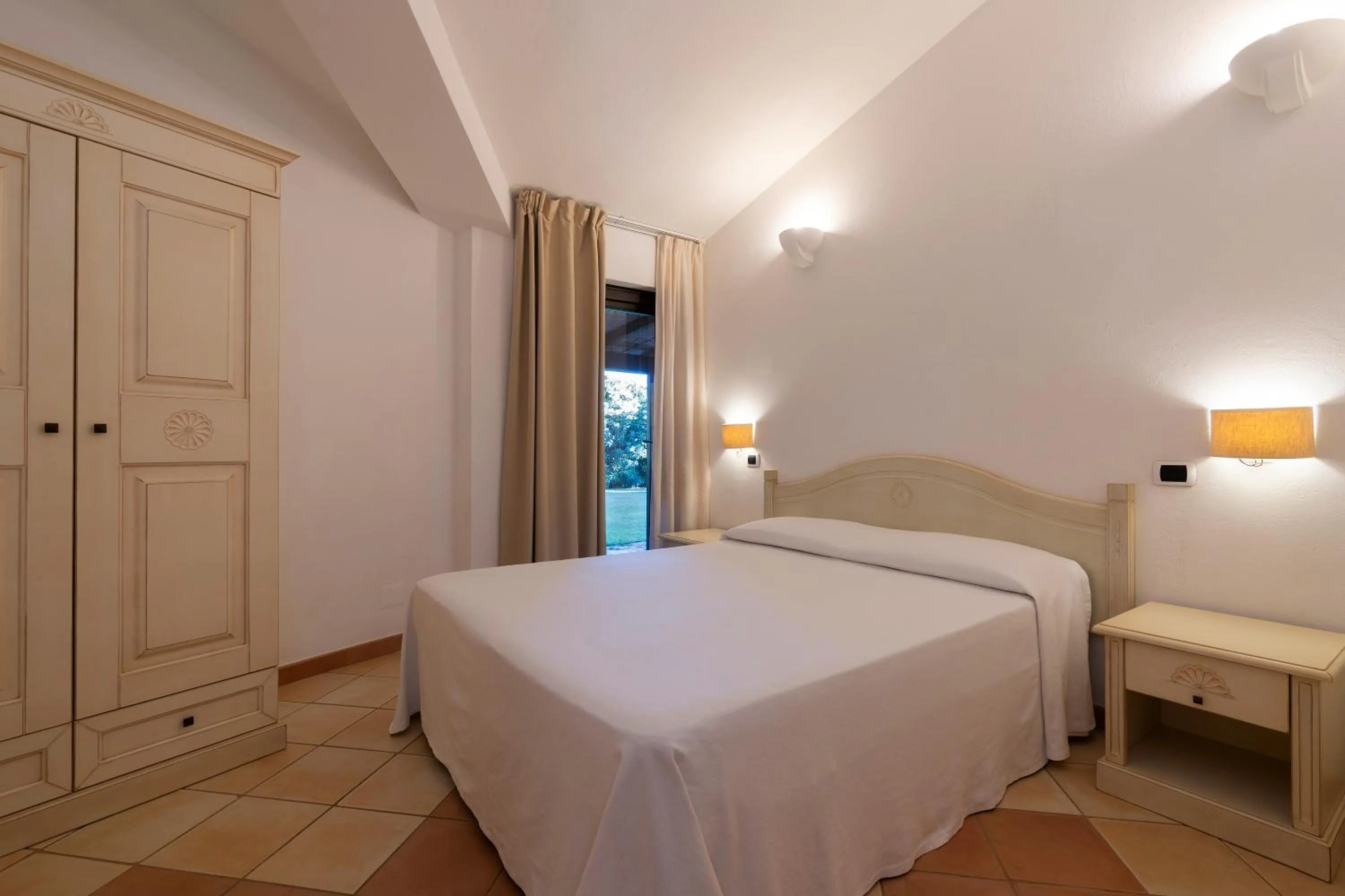 Bed in Porto Giunco Residence