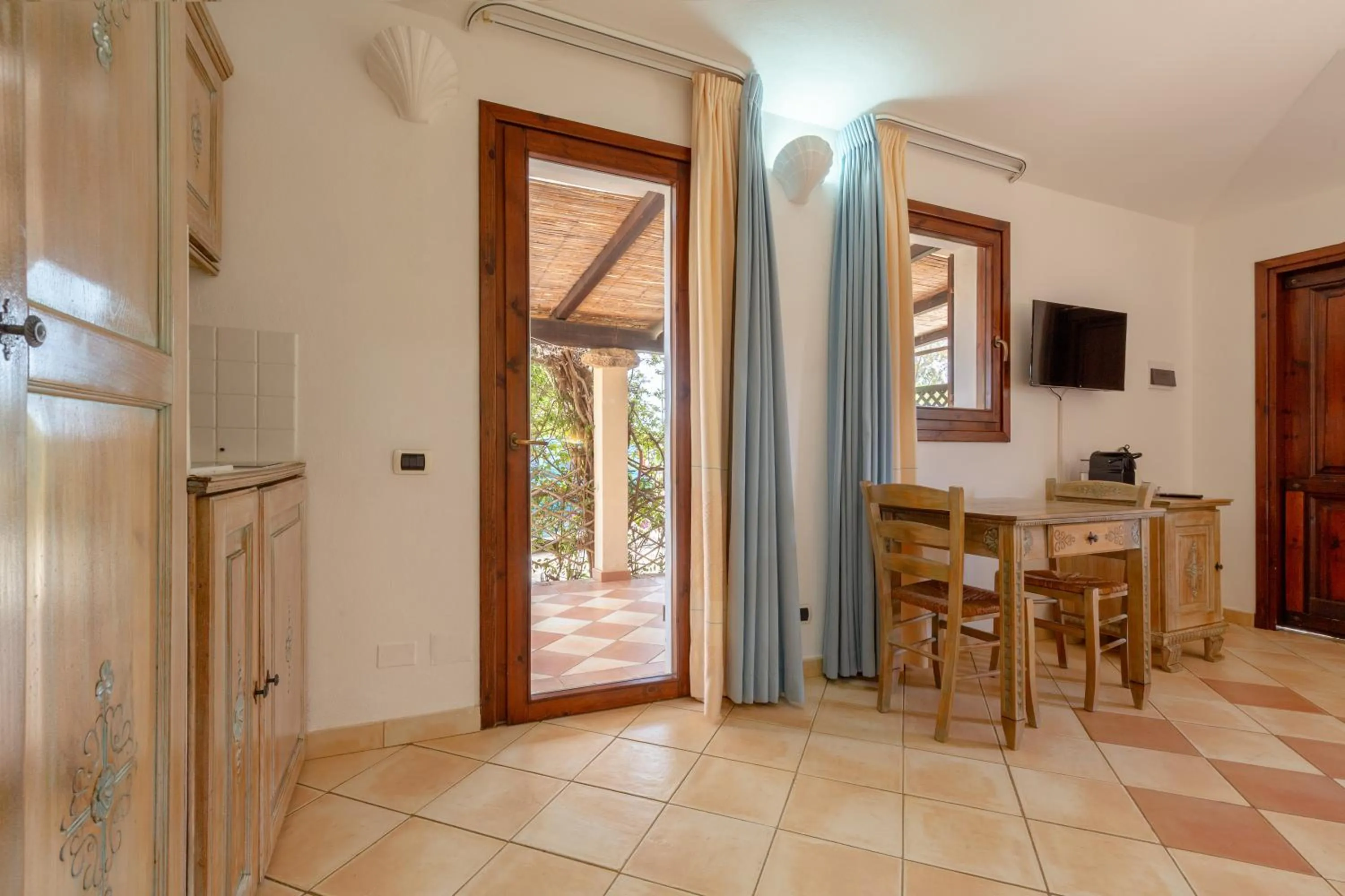 Dining area in Porto Giunco Residence