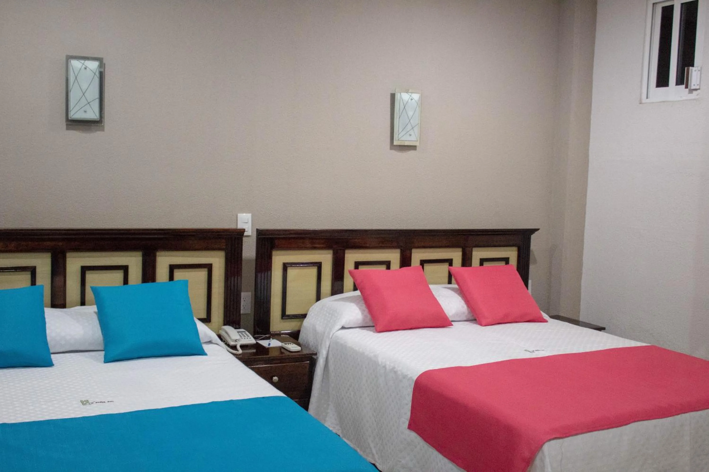 Bed in HOTEL DE LA PEÑA INN