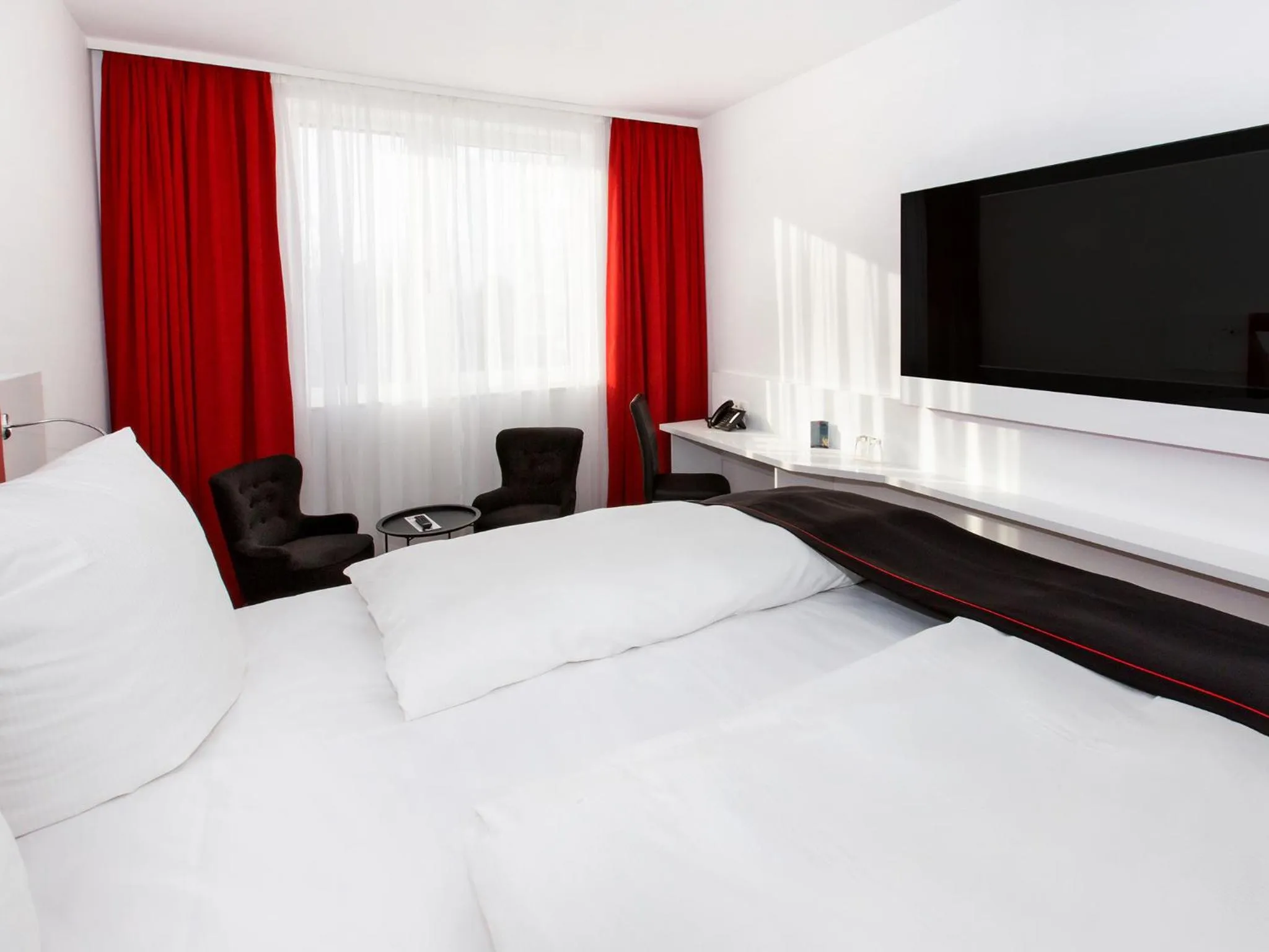 Photo of the whole room, Bed in DORMERO Hotel Salzgitter
