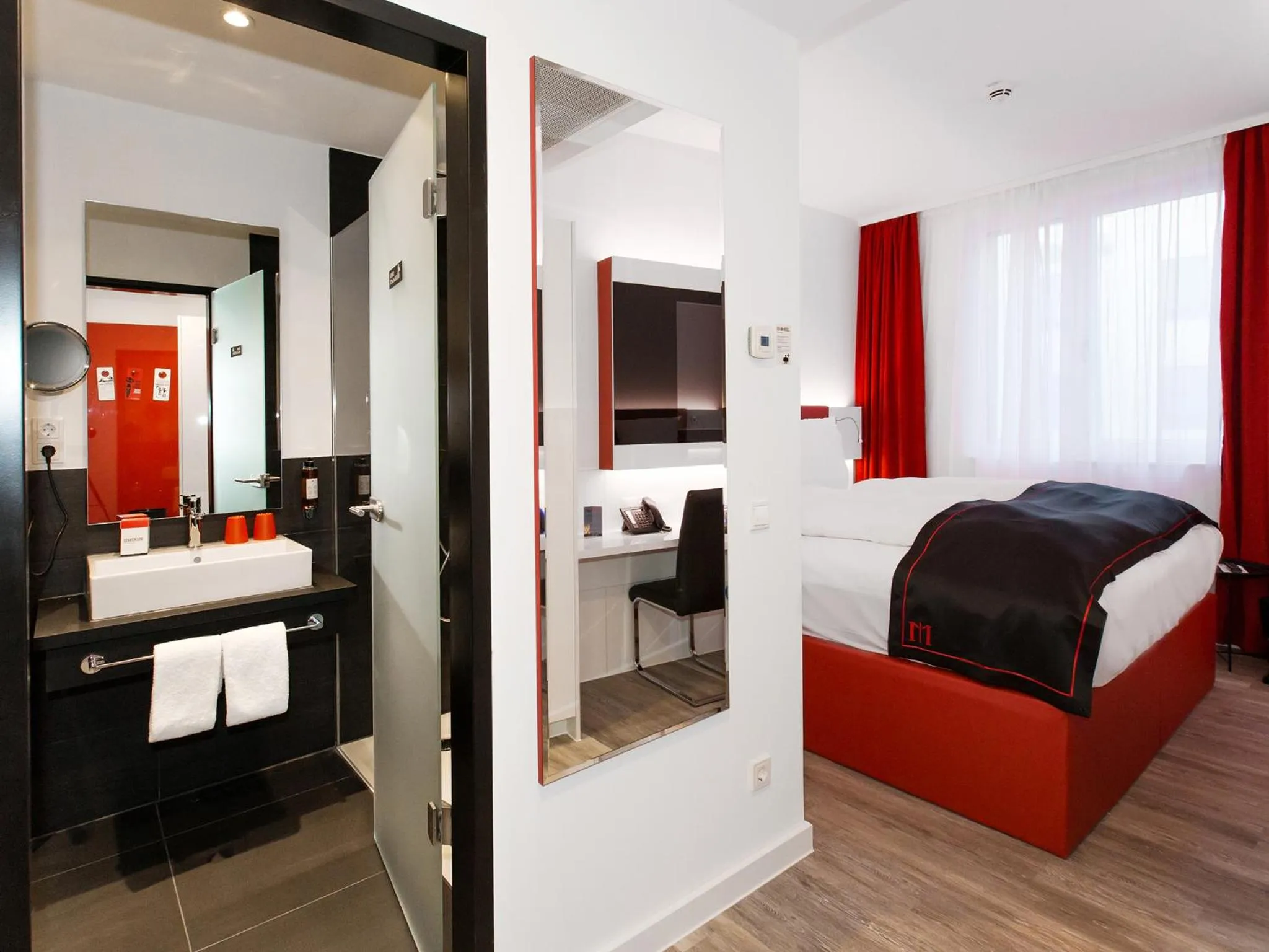 Photo of the whole room, Bed in DORMERO Hotel Salzgitter