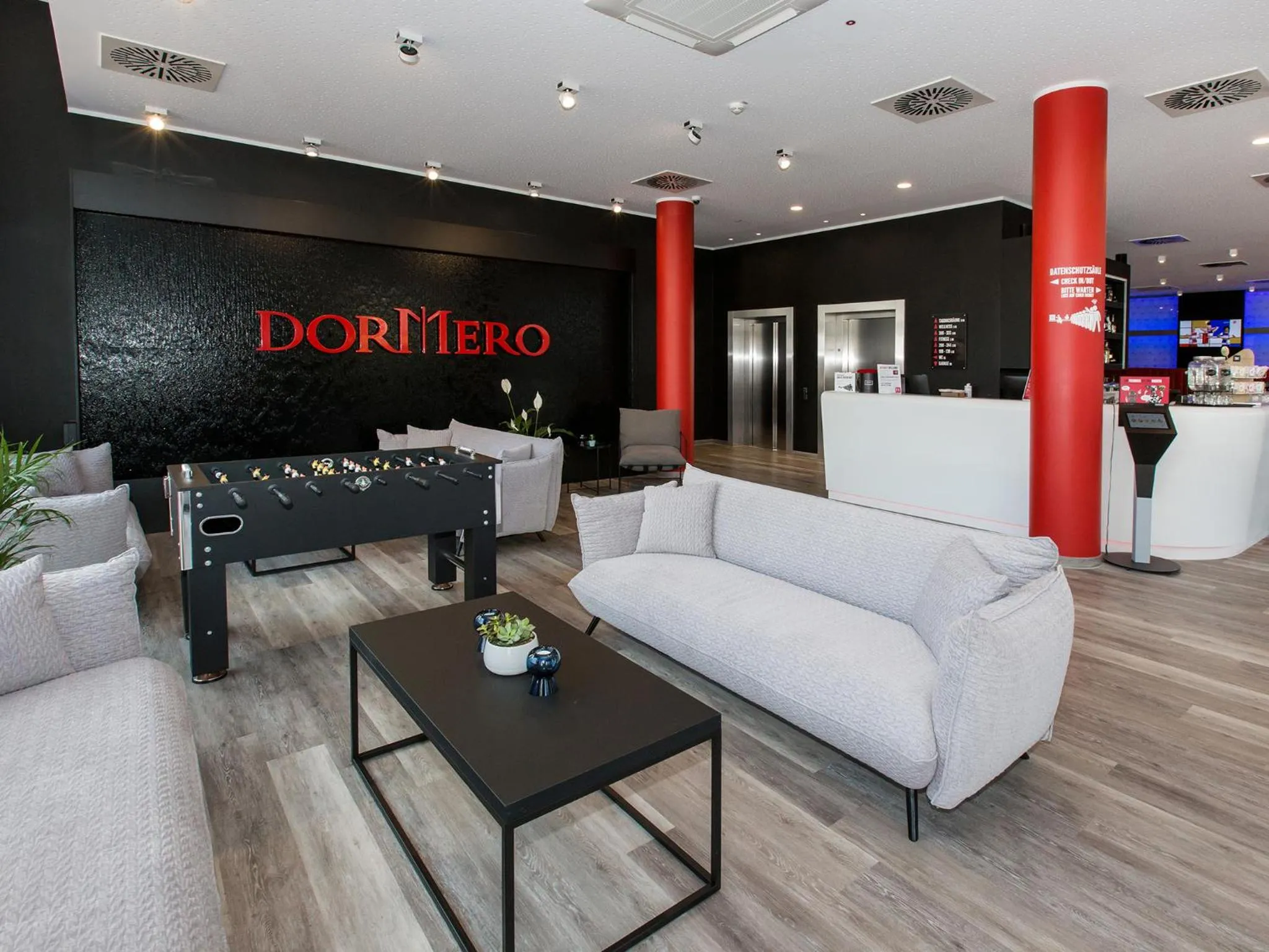 Lobby or reception in DORMERO Hotel Salzgitter