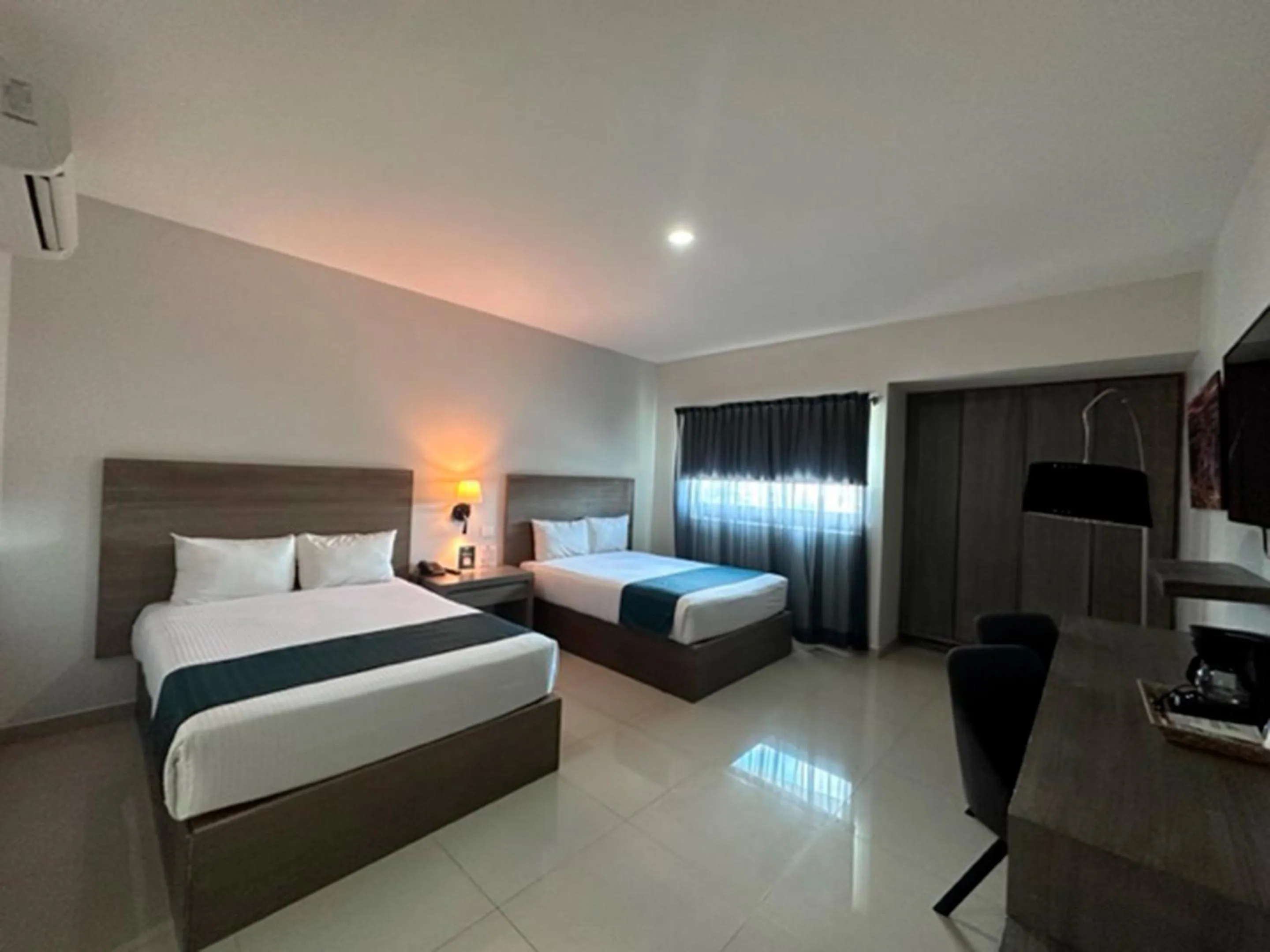 Bed in InHouse Hotel Culiacán