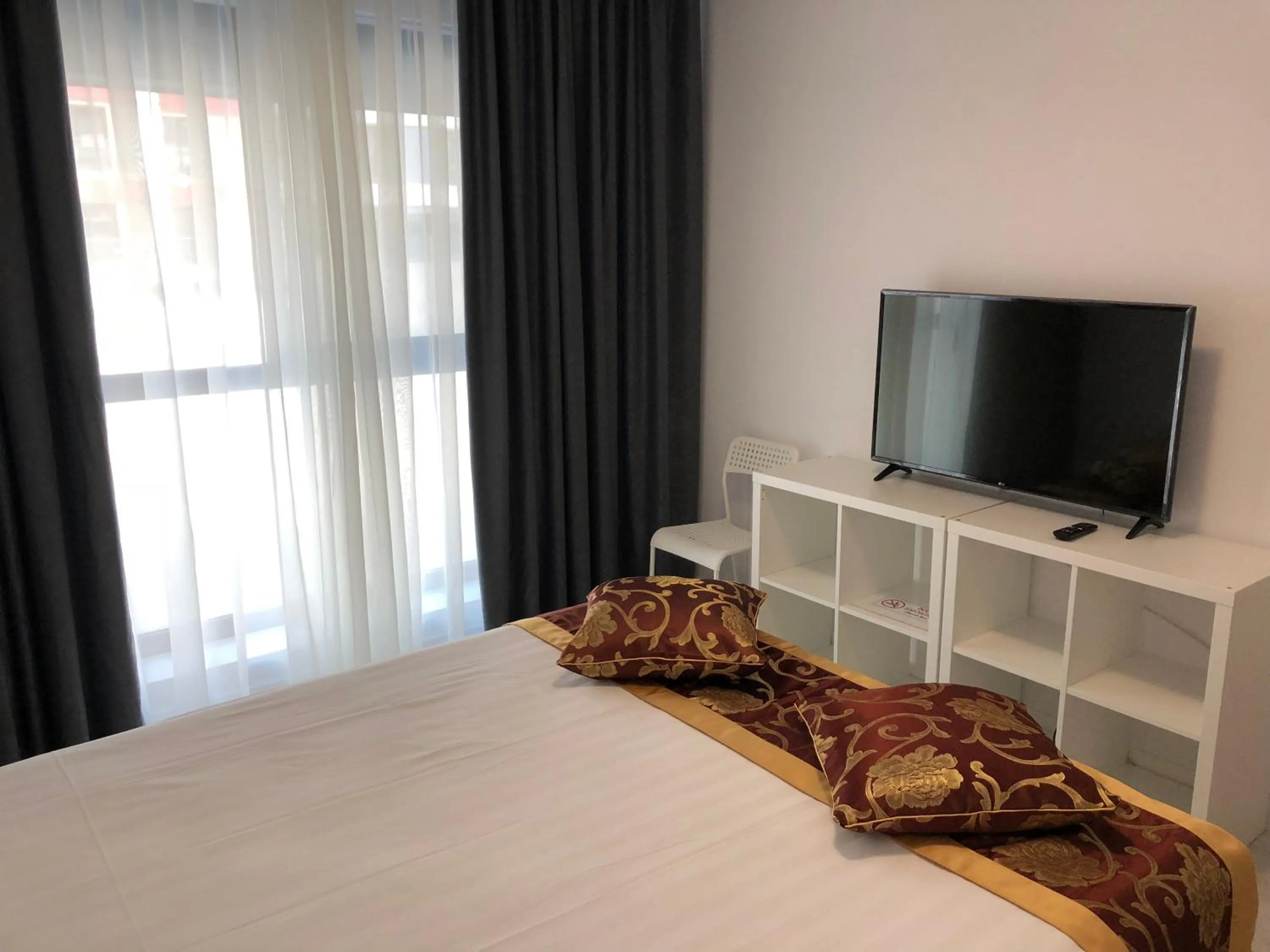 Bed in 21 Residence Apartments