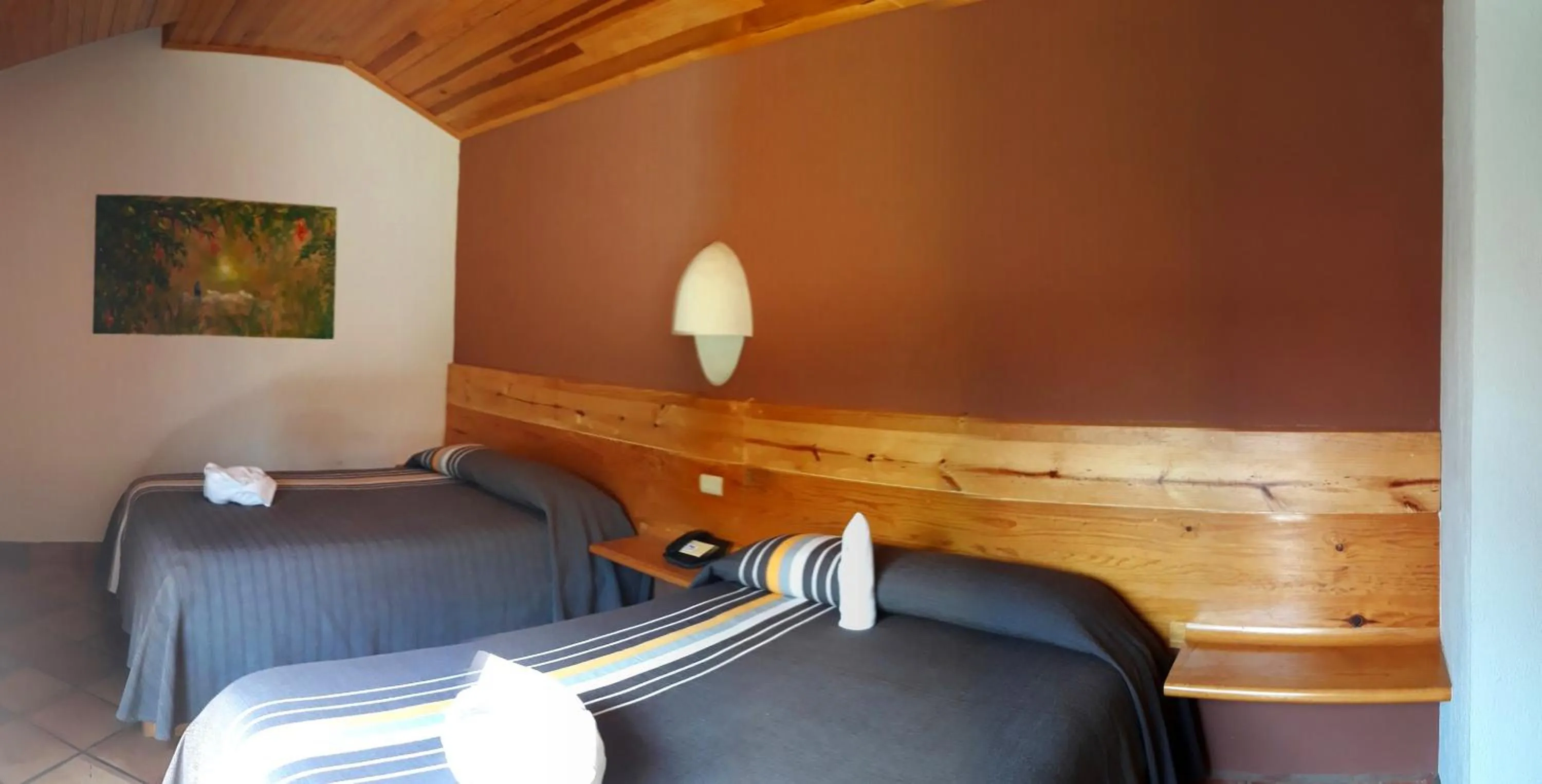 Bed in Axkan Arte Hotel