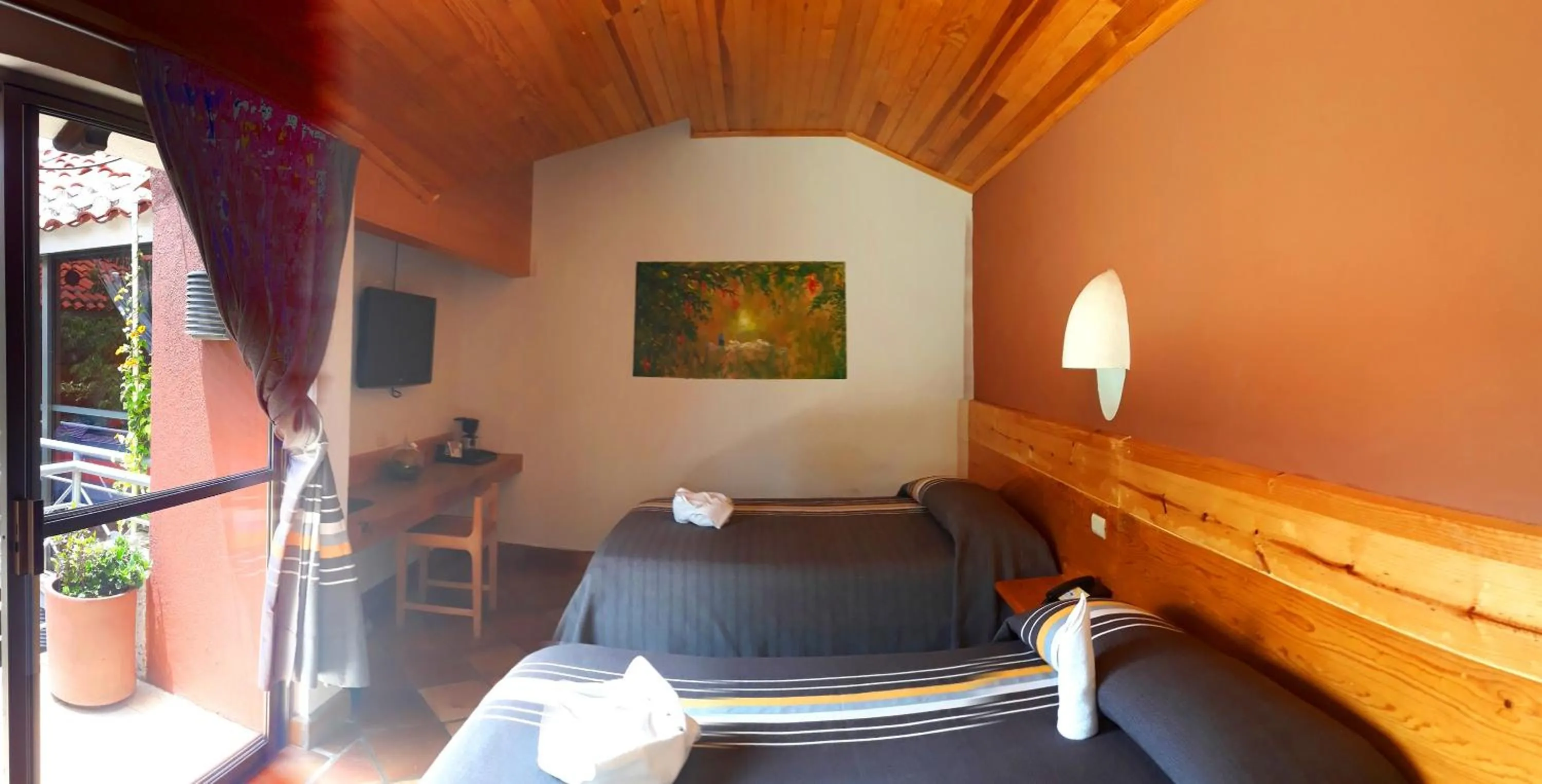 Bed in Axkan Arte Hotel