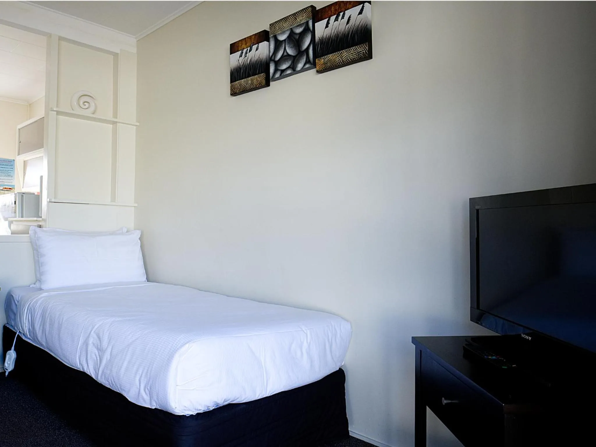 Bed in Tairua Shores Motel