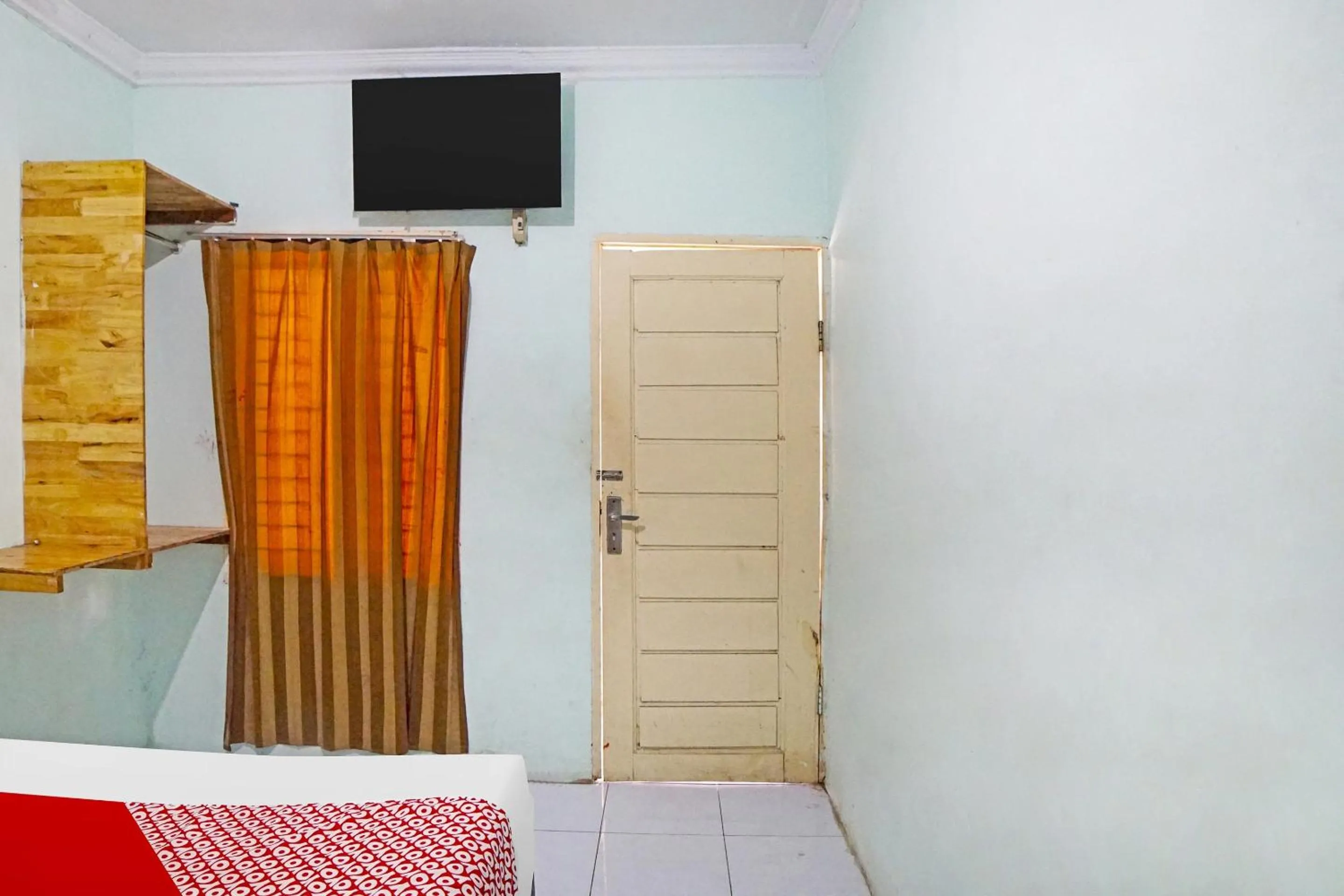 Bedroom in Hotel O Puri Dennis