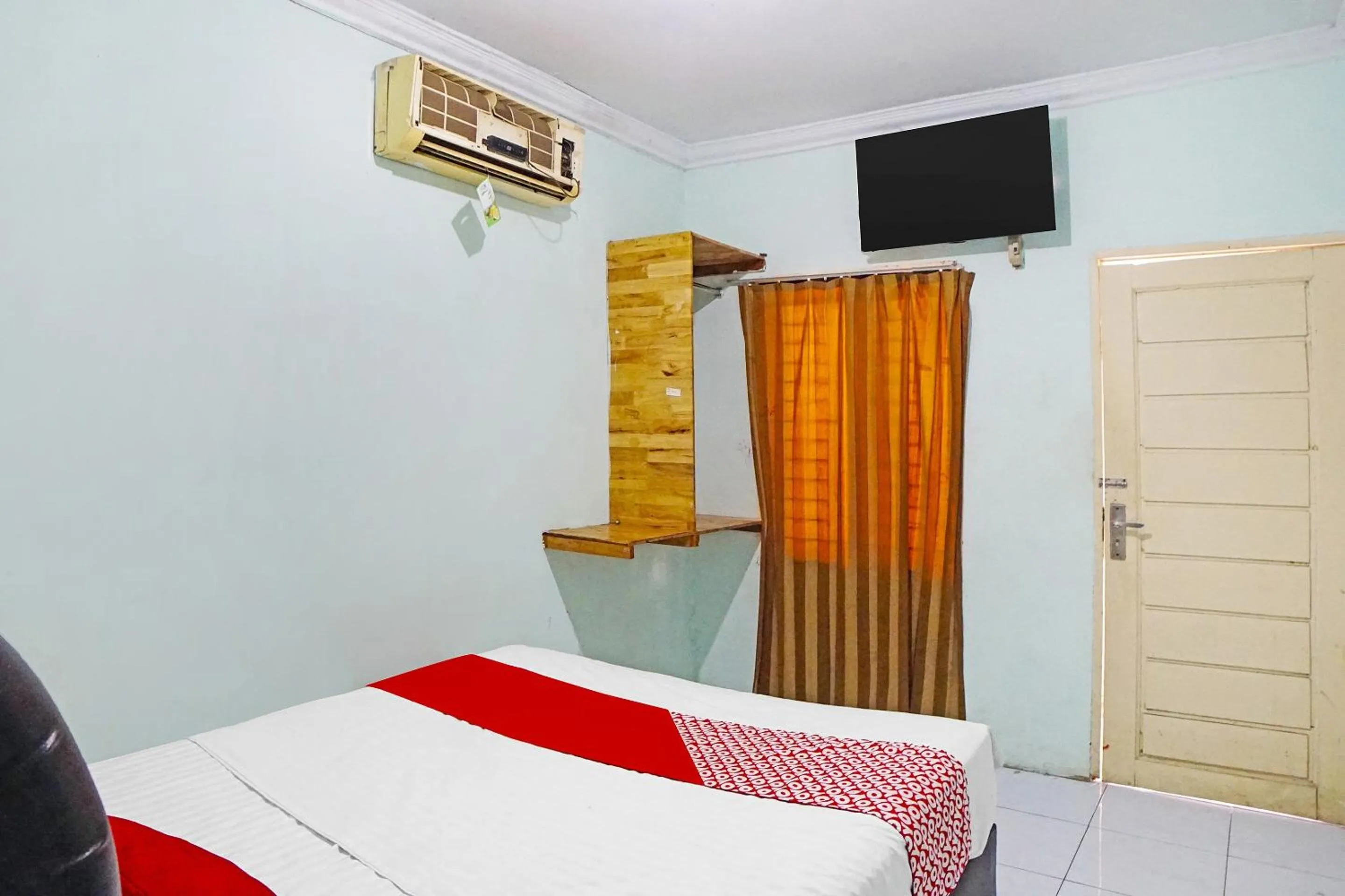 Bedroom in Hotel O Puri Dennis