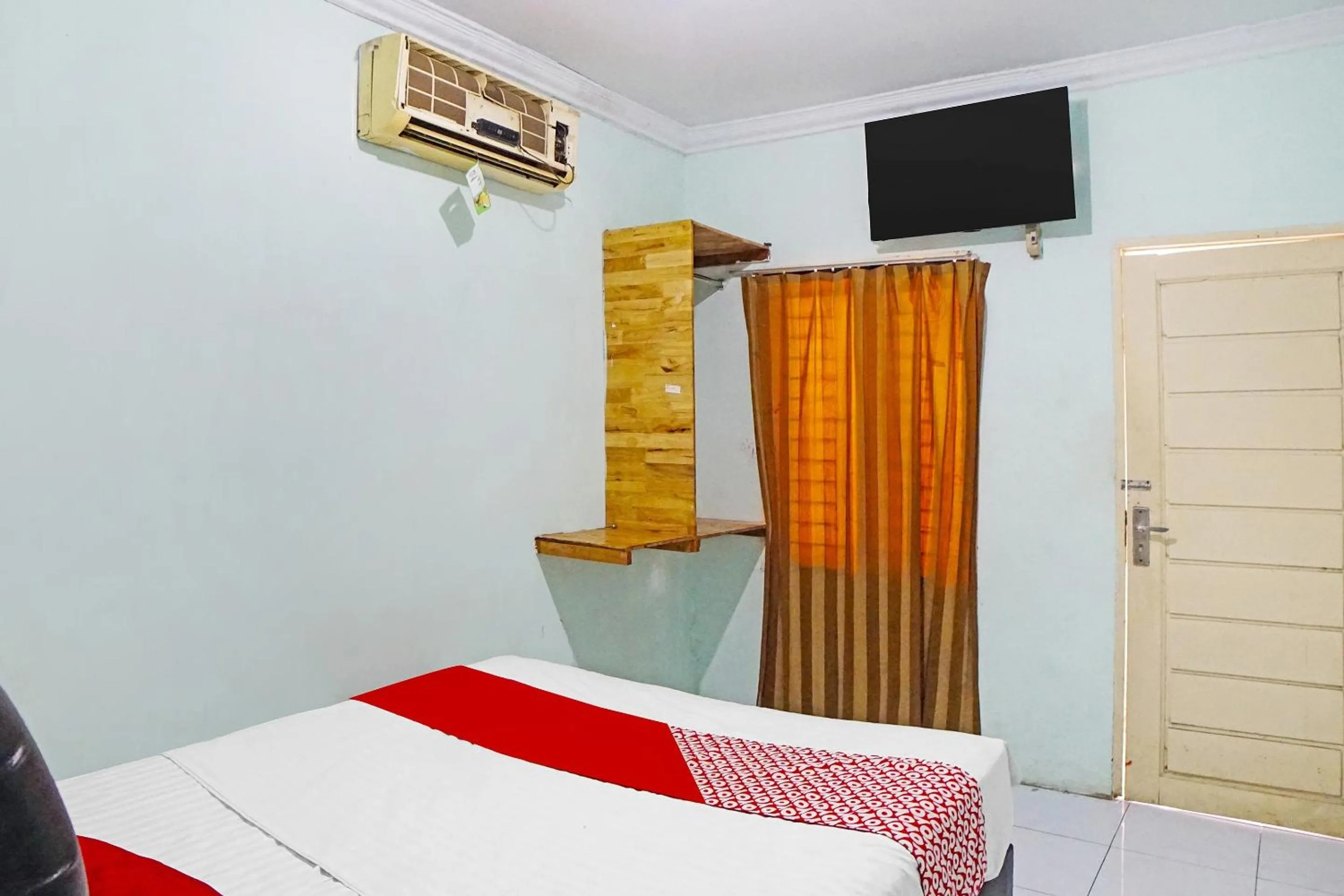 Bedroom in Hotel O Puri Dennis