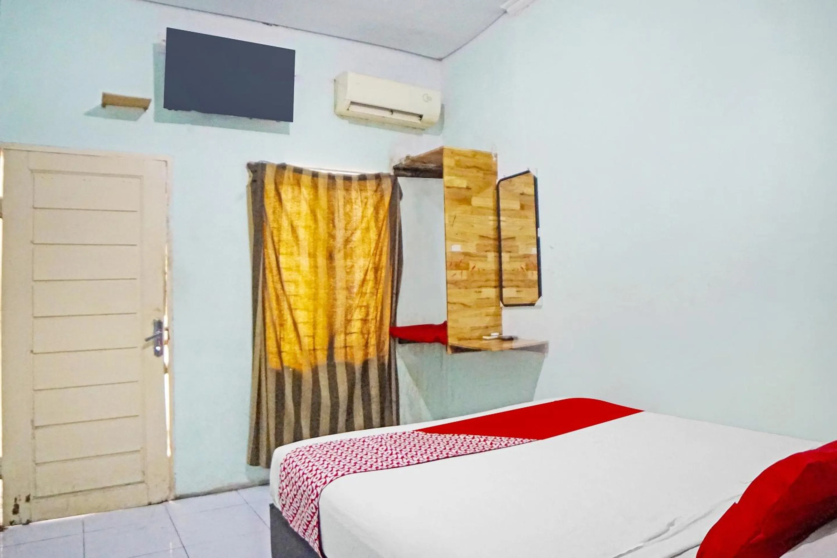 Bedroom in Hotel O Puri Dennis