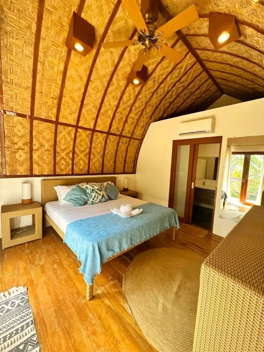 Bed in Tropical Temple Siargao Resort