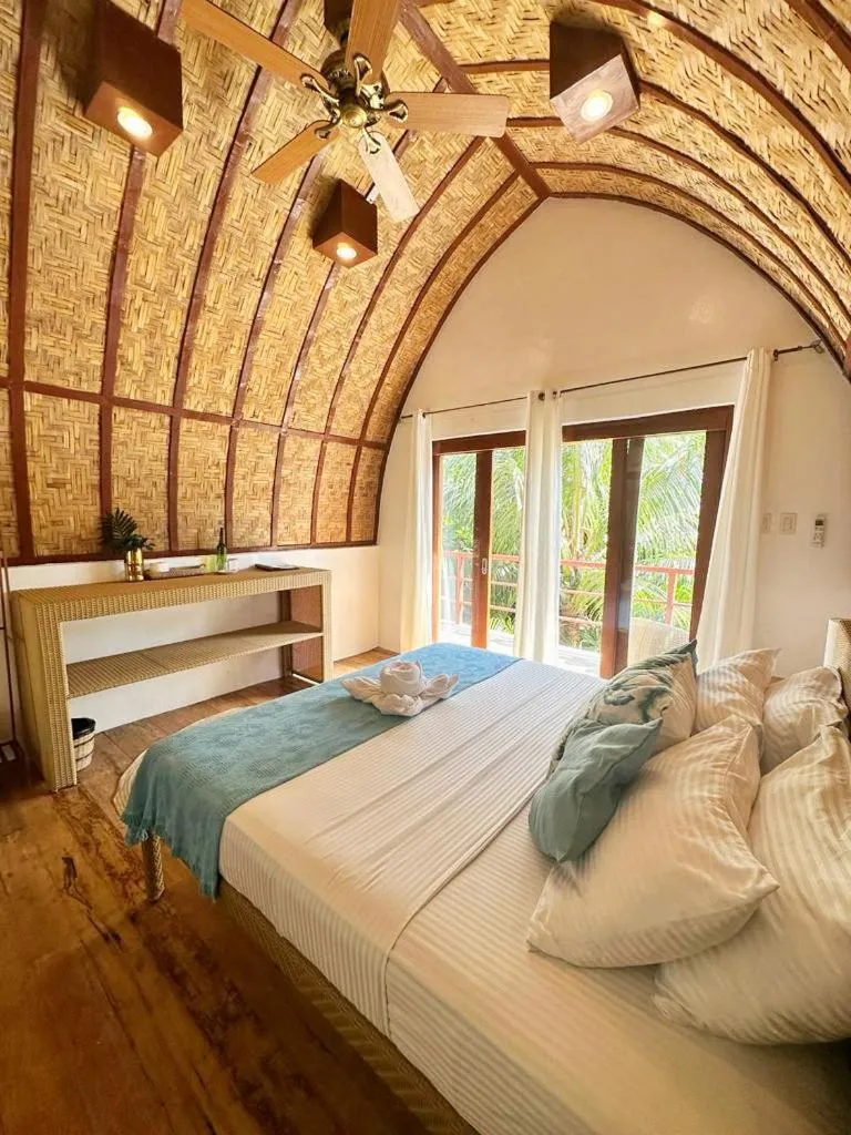 Bed in Tropical Temple Siargao Resort