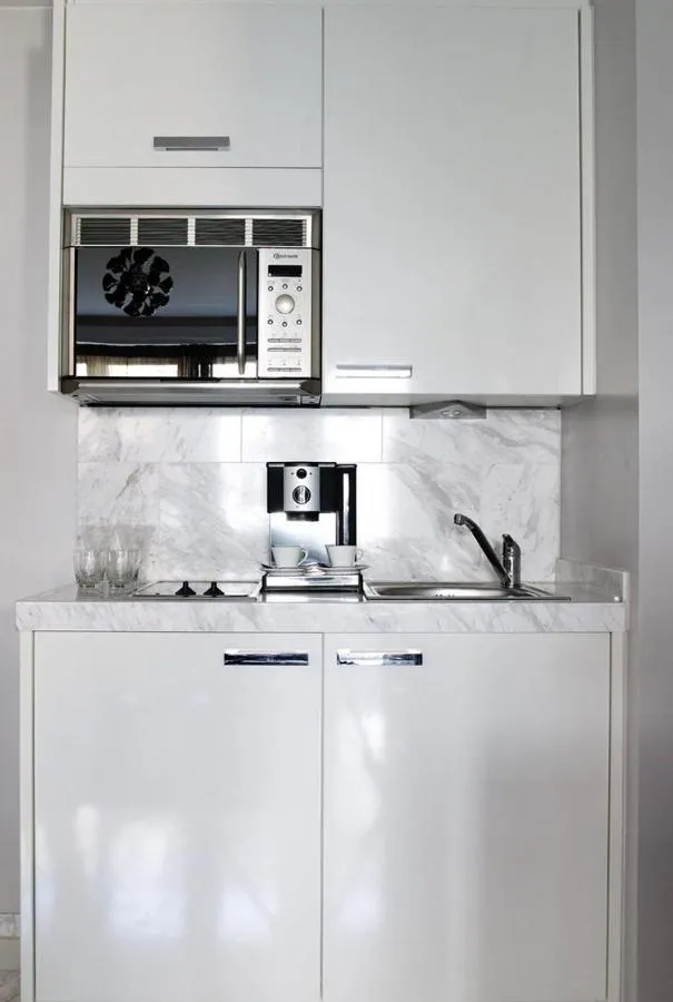 Kitchen or kitchenette in VISIONAPARTMENTS Freyastrasse - contactless check-in