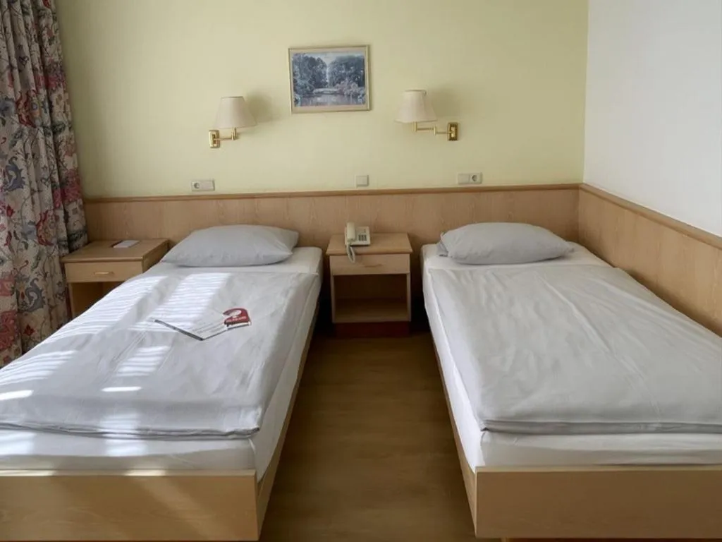 Bed in Hotel Rosenheim