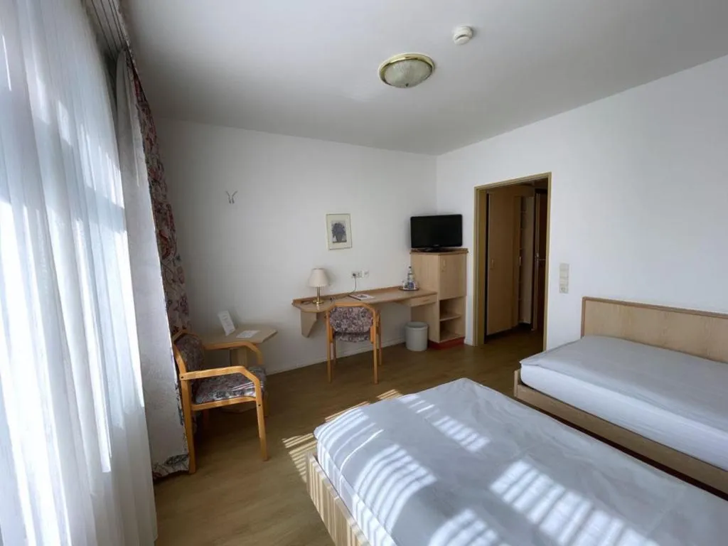 Bed in Hotel Rosenheim