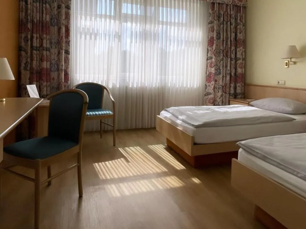 Bed in Hotel Rosenheim