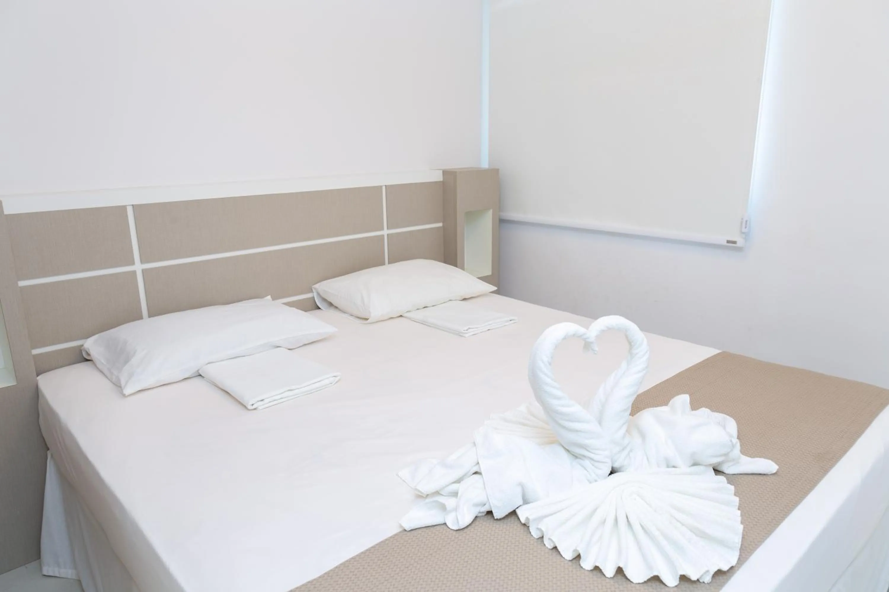 Bed in Golf Ville Resorts Suites