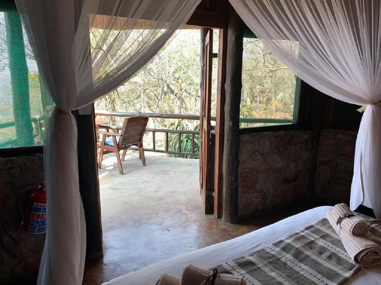Balcony/Terrace, Bed in Shayamoya Tiger Fishing and Game Lodge