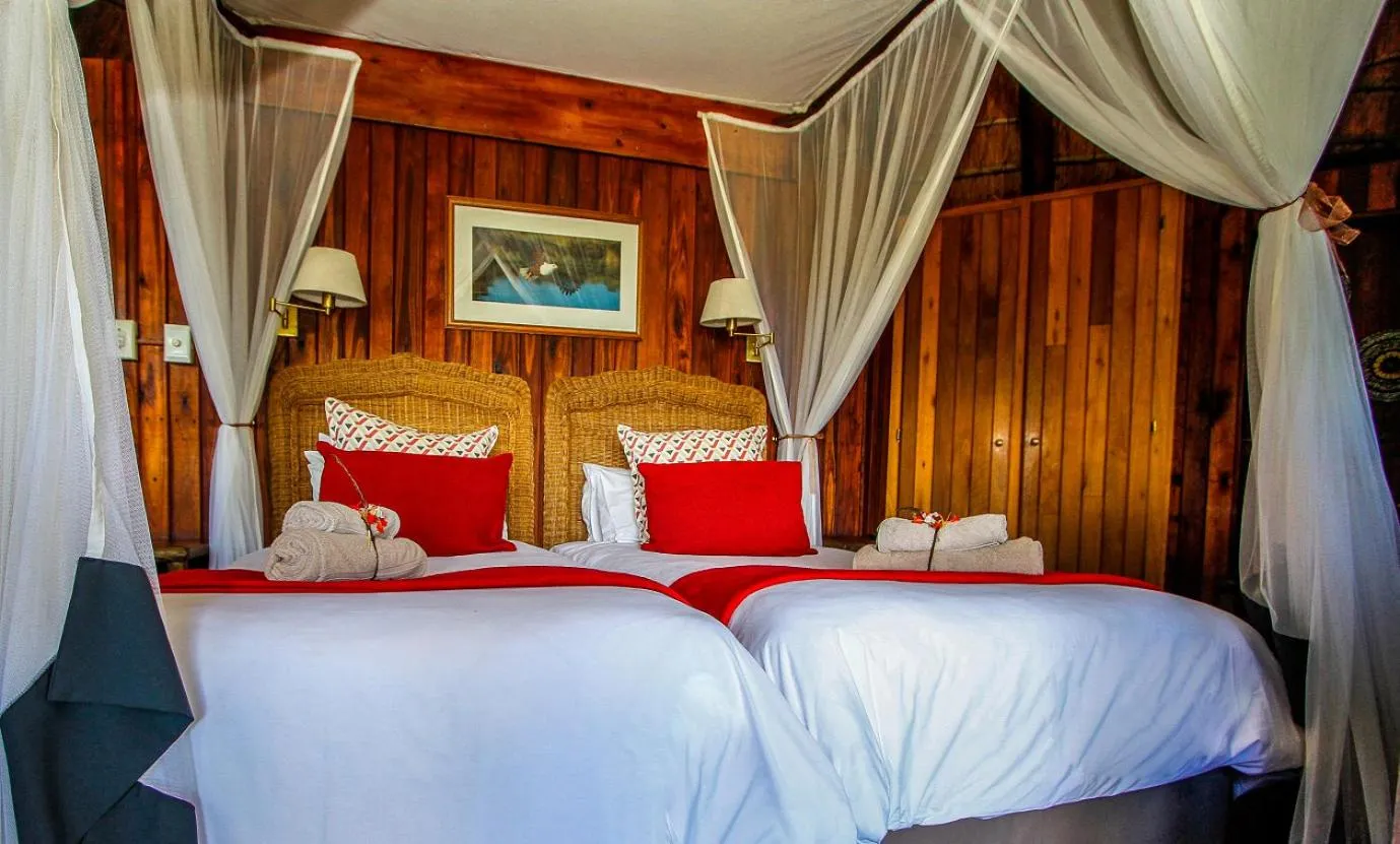 Bed in Shayamoya Tiger Fishing and Game Lodge