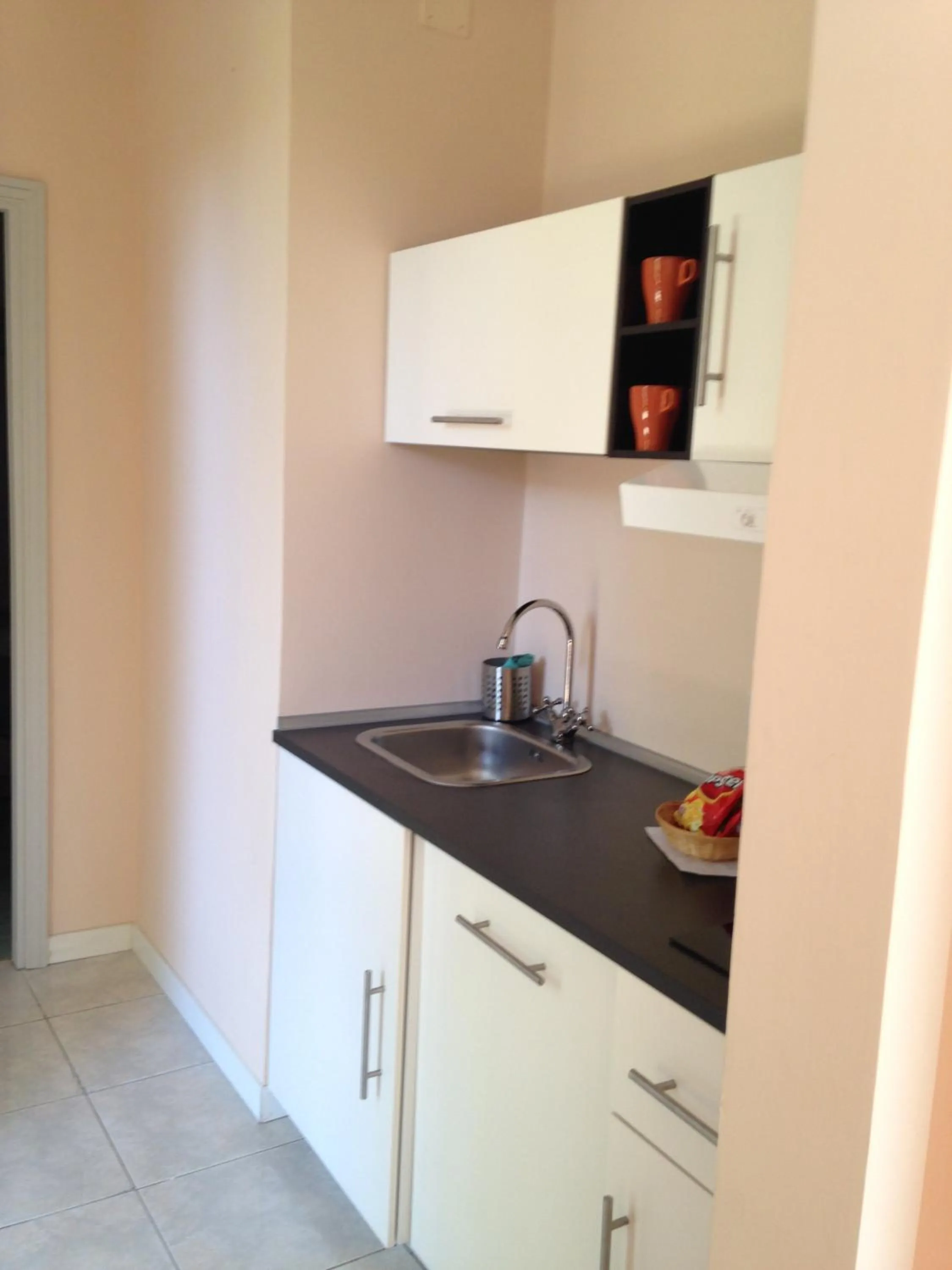 Kitchen or kitchenette in Garden Hotel