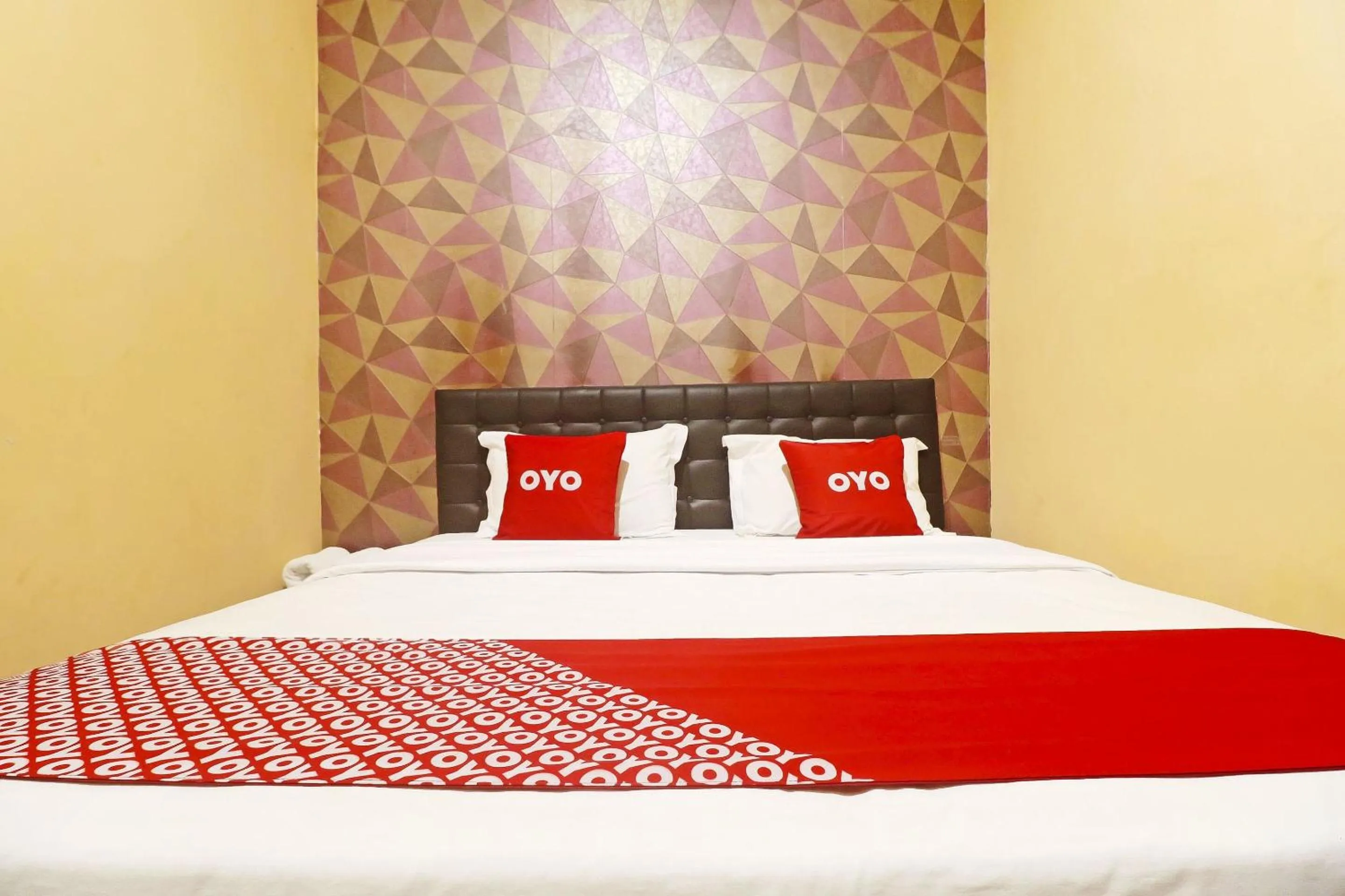 Bedroom in Hotel O Papi Inn Guesthouse