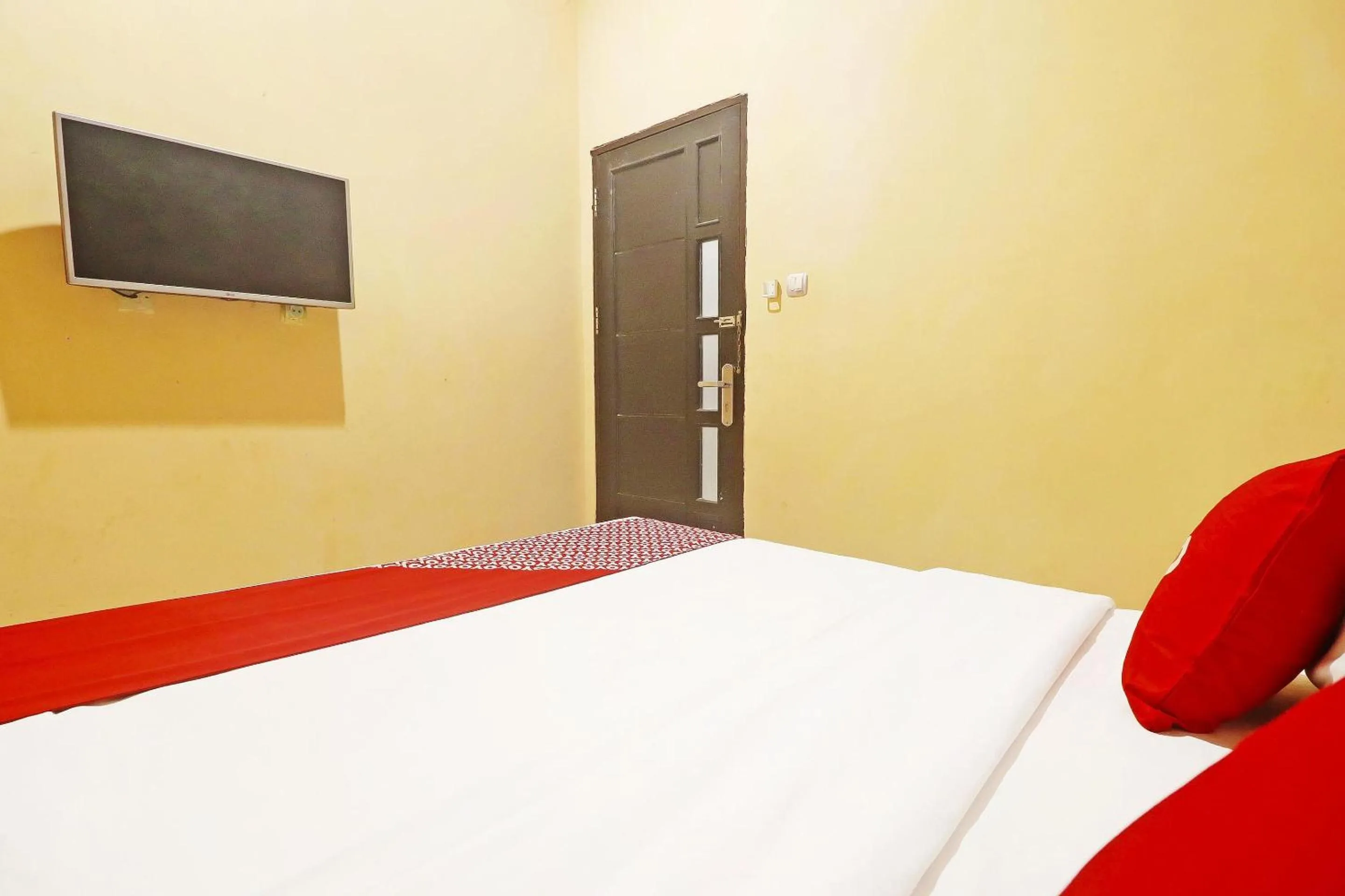 Bedroom in Hotel O Papi Inn Guesthouse