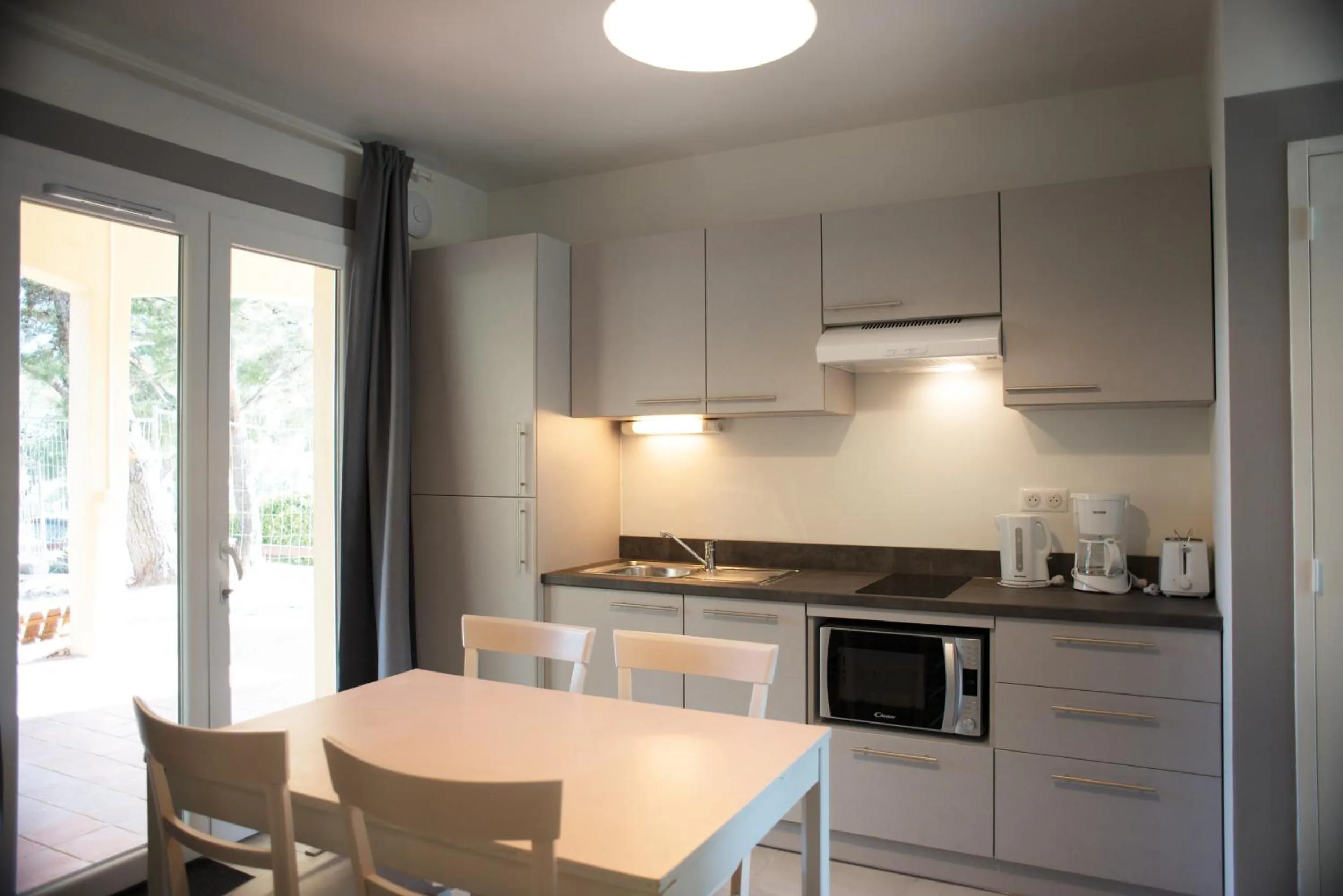 Kitchen or kitchenette in Appartements des Joncas
