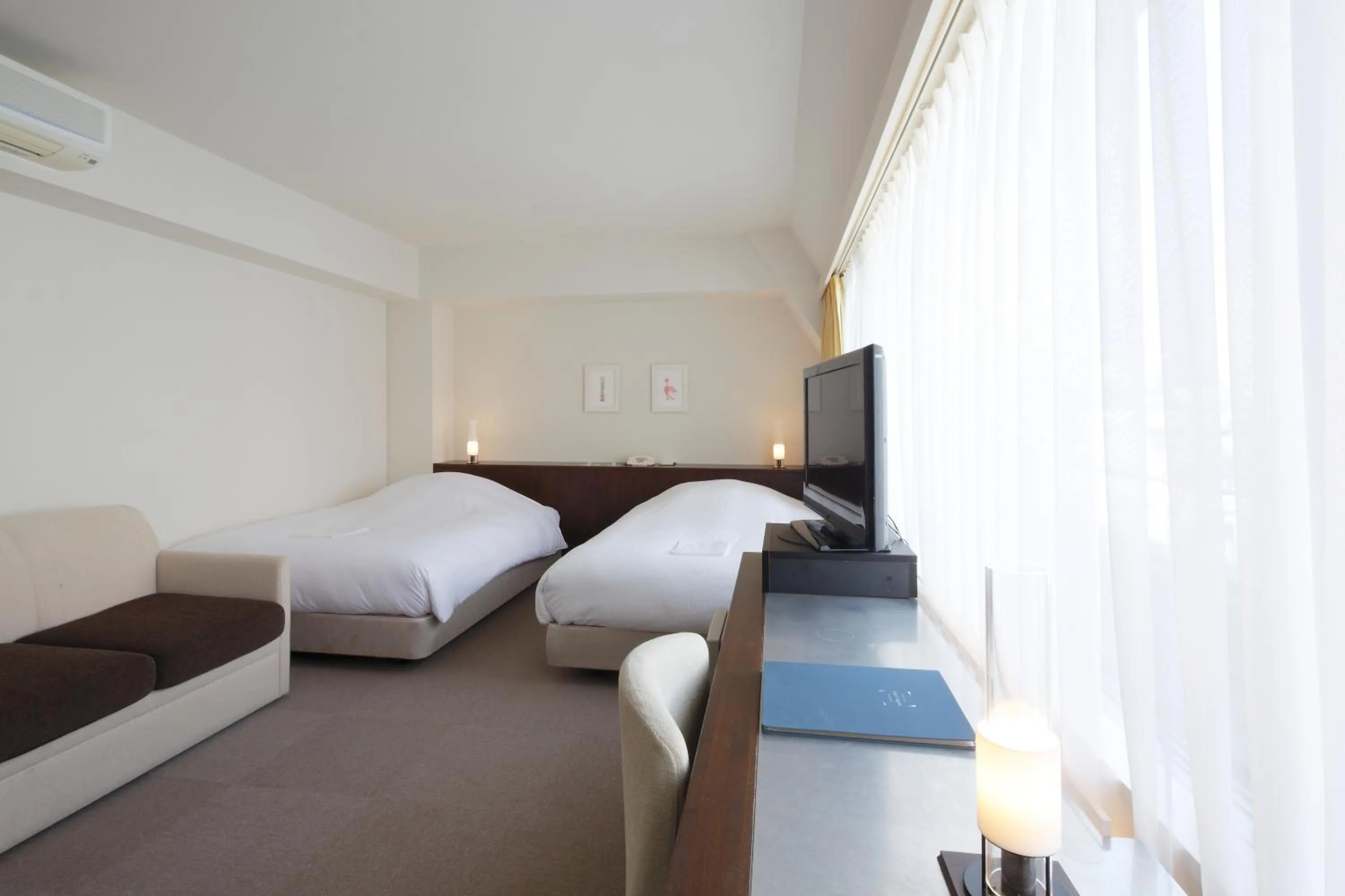 Bed in Hotel Garden Square Shizuoka