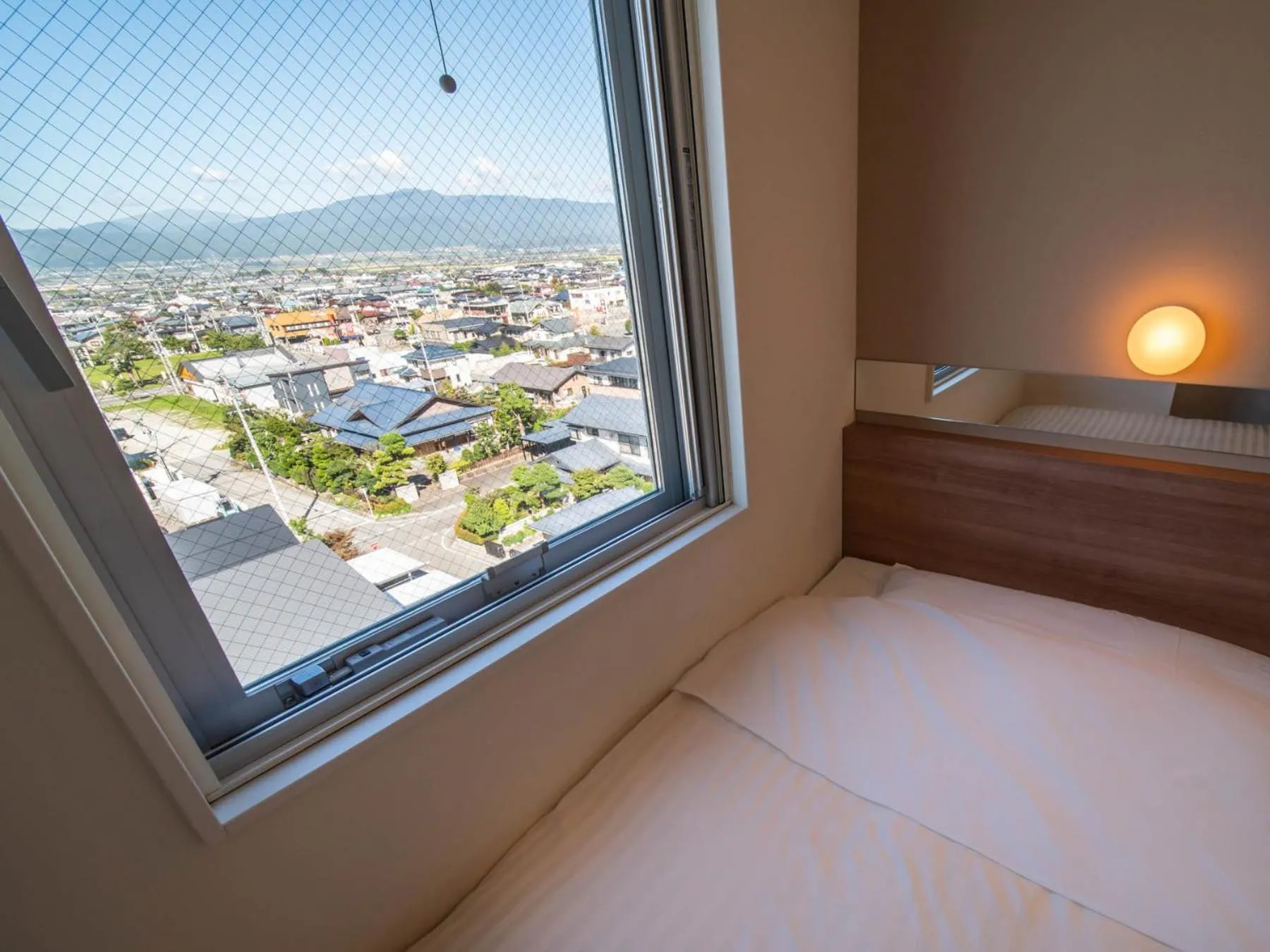 City view, Bed in Super Hotel Yamagata Sakurambo-Higashine Station Front
