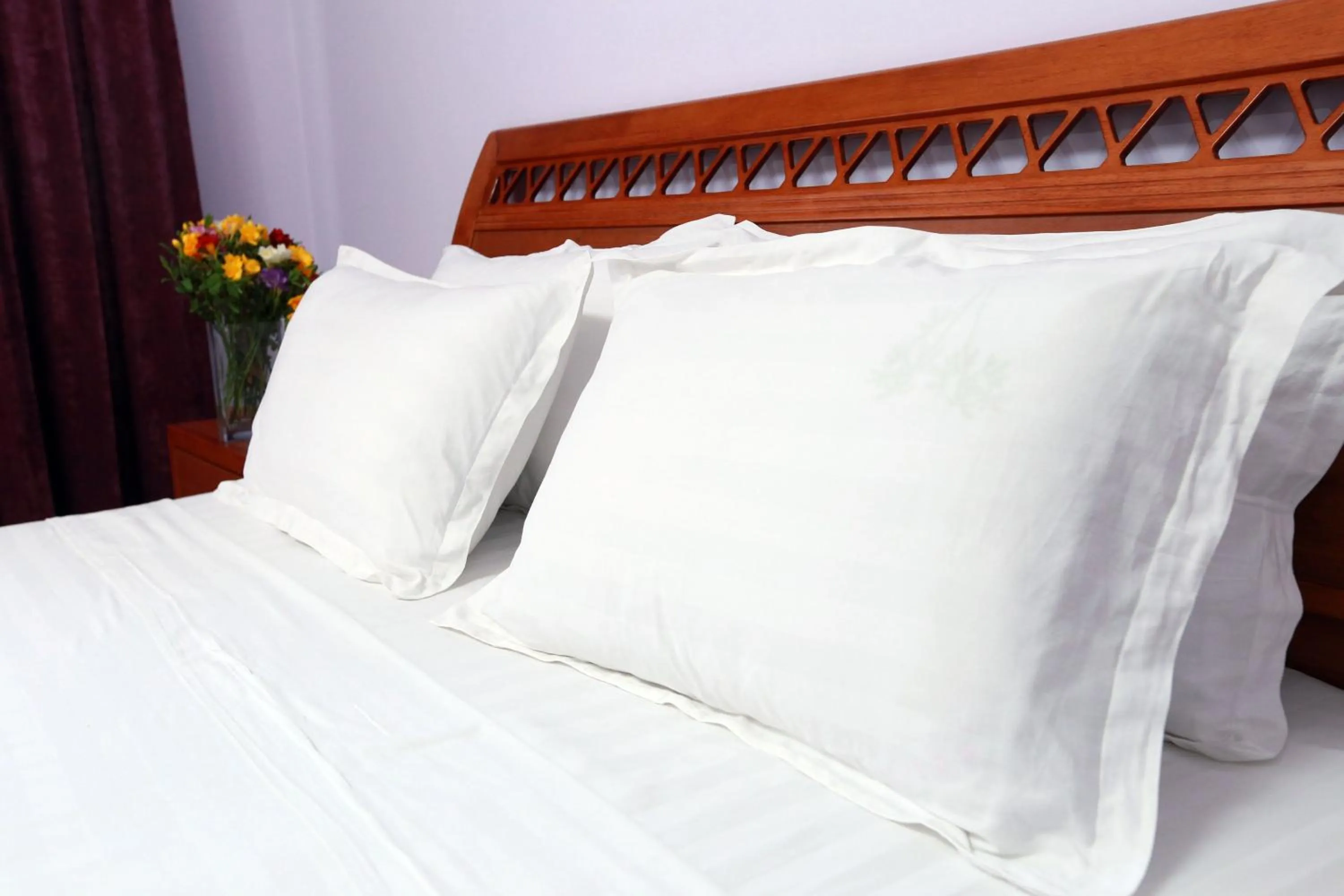 Bed in Soluxe Hotel
