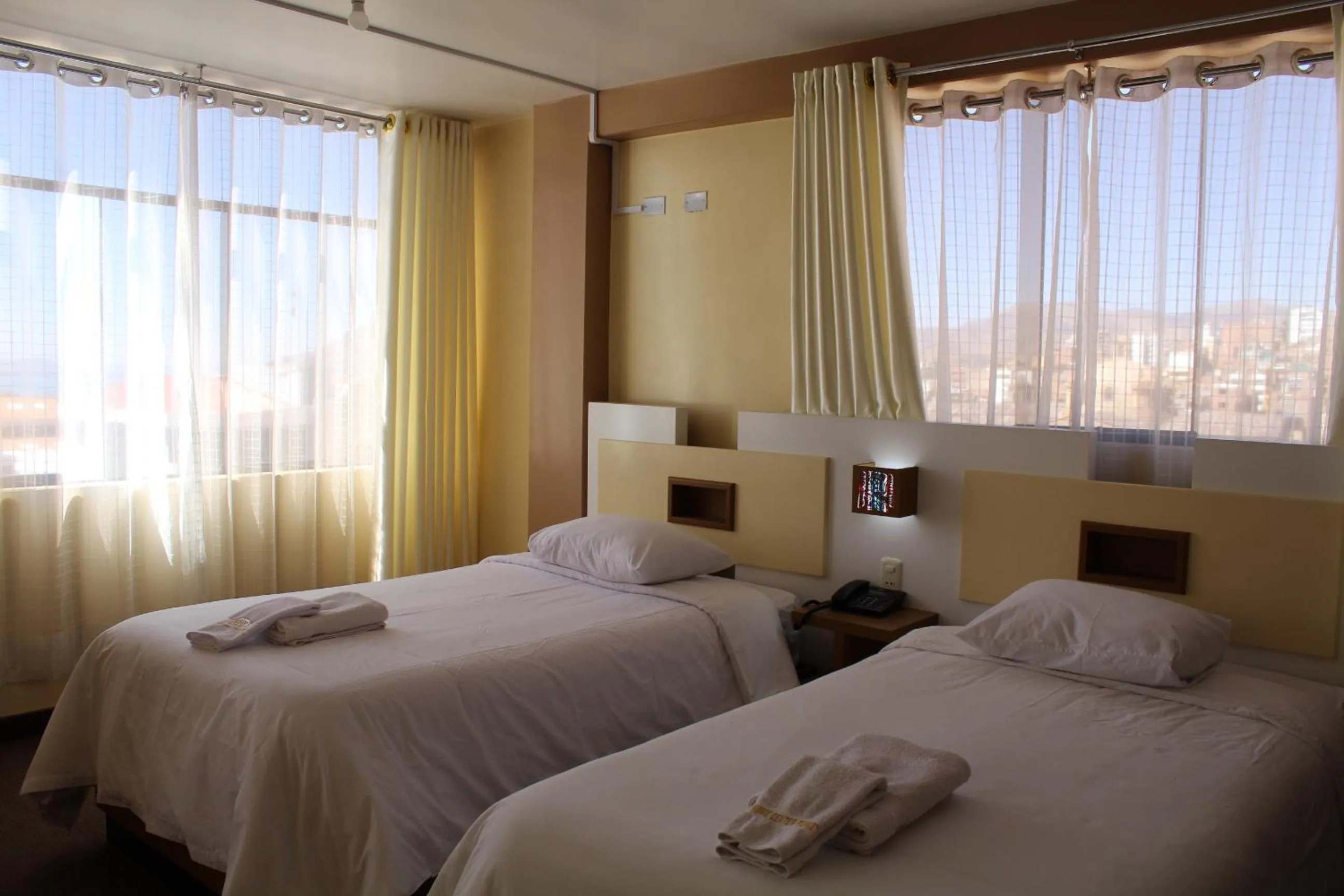 Bed in Kaaro Hotel Puno