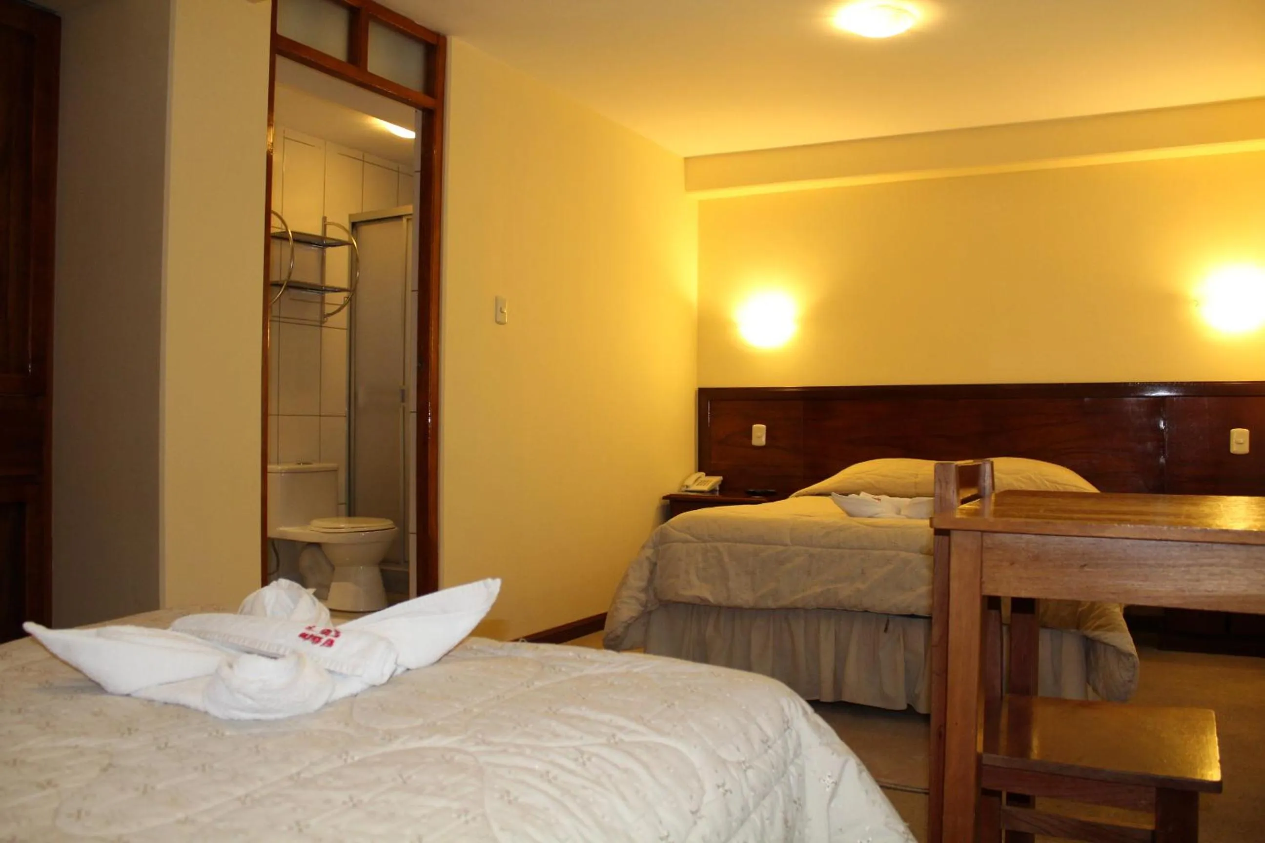 Bed in Kaaro Hotel Puno