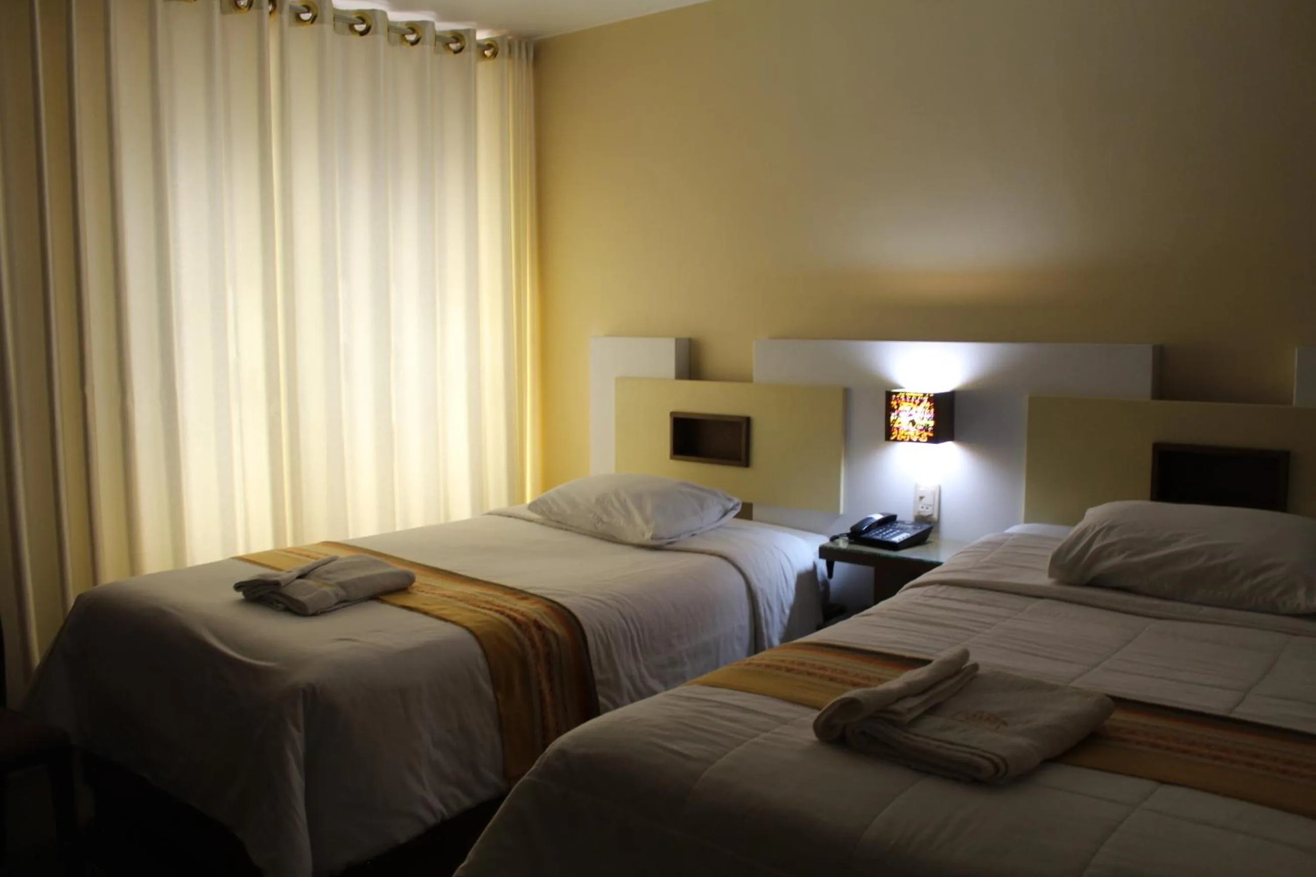 Bed in Kaaro Hotel Puno