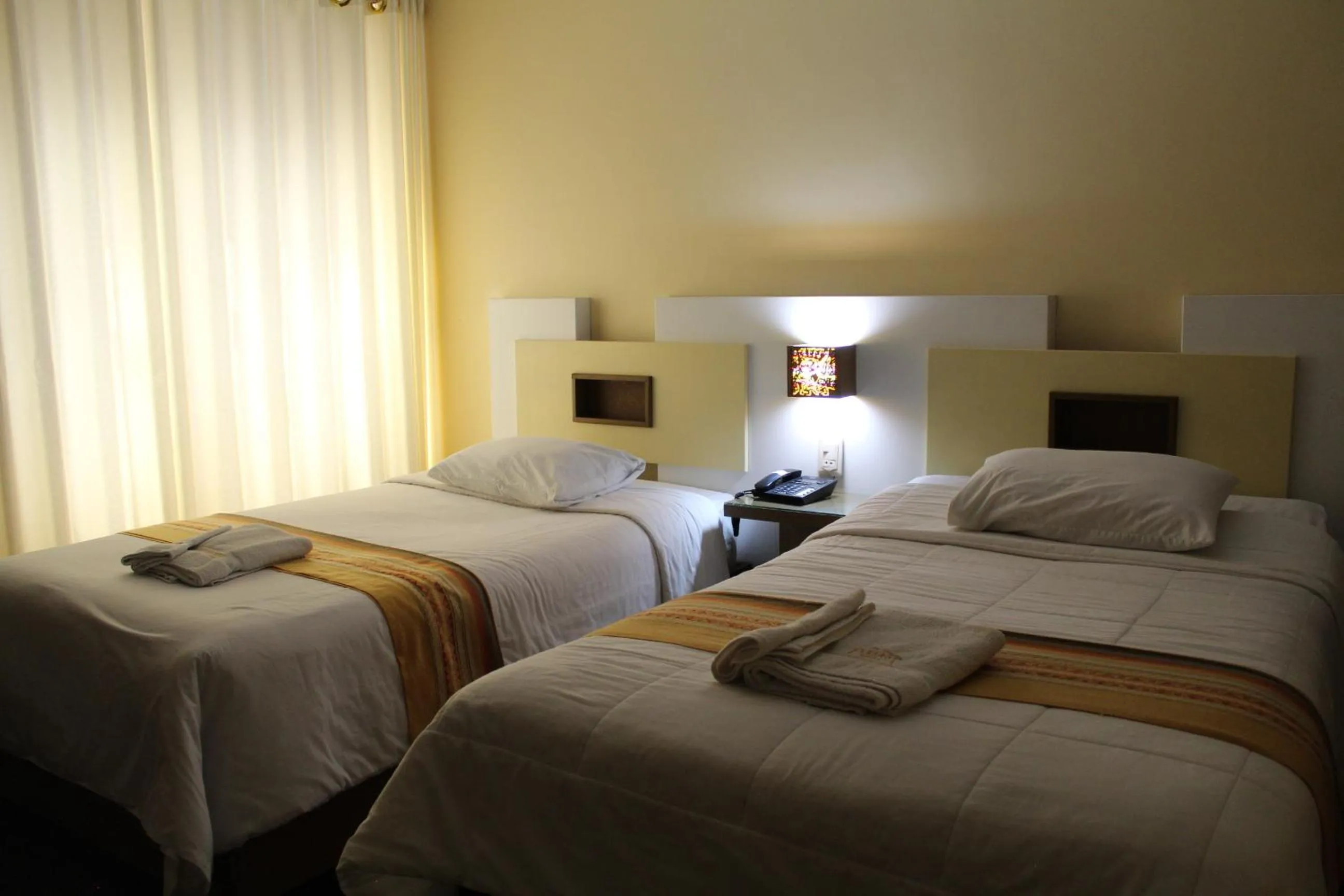 Bed in Kaaro Hotel Puno