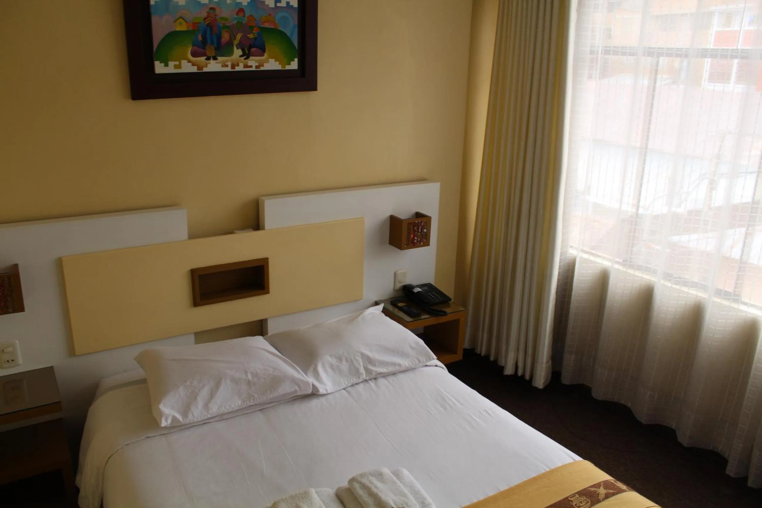 Bed in Kaaro Hotel Puno