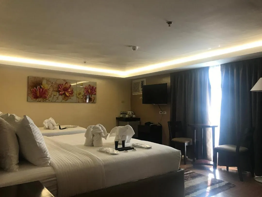 Bedroom, Bed in Treasure Island Hotel With Mini Water Adventure