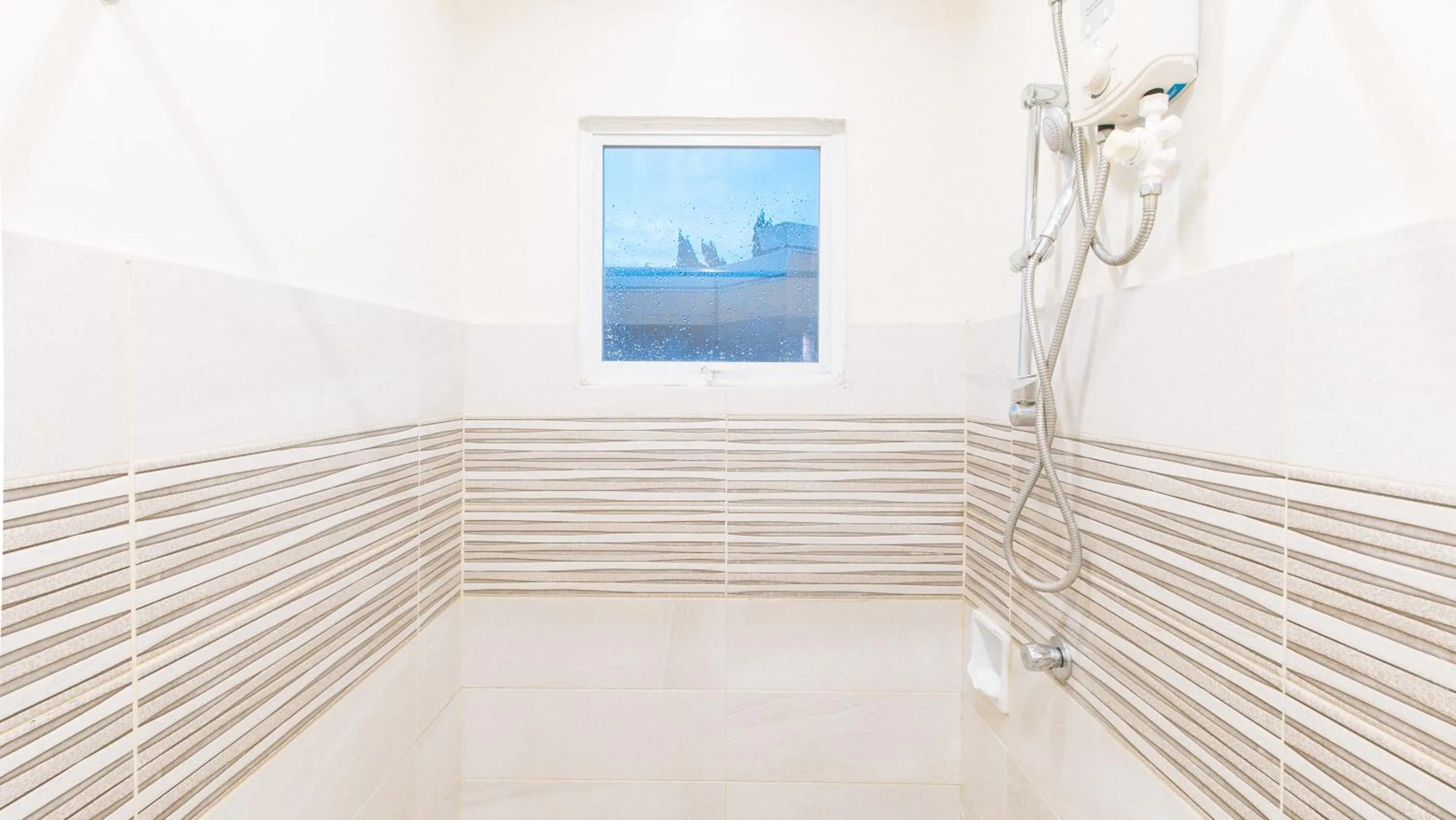 Shower in UrbanView at Lacson Street Bacolod City by RedDoorz