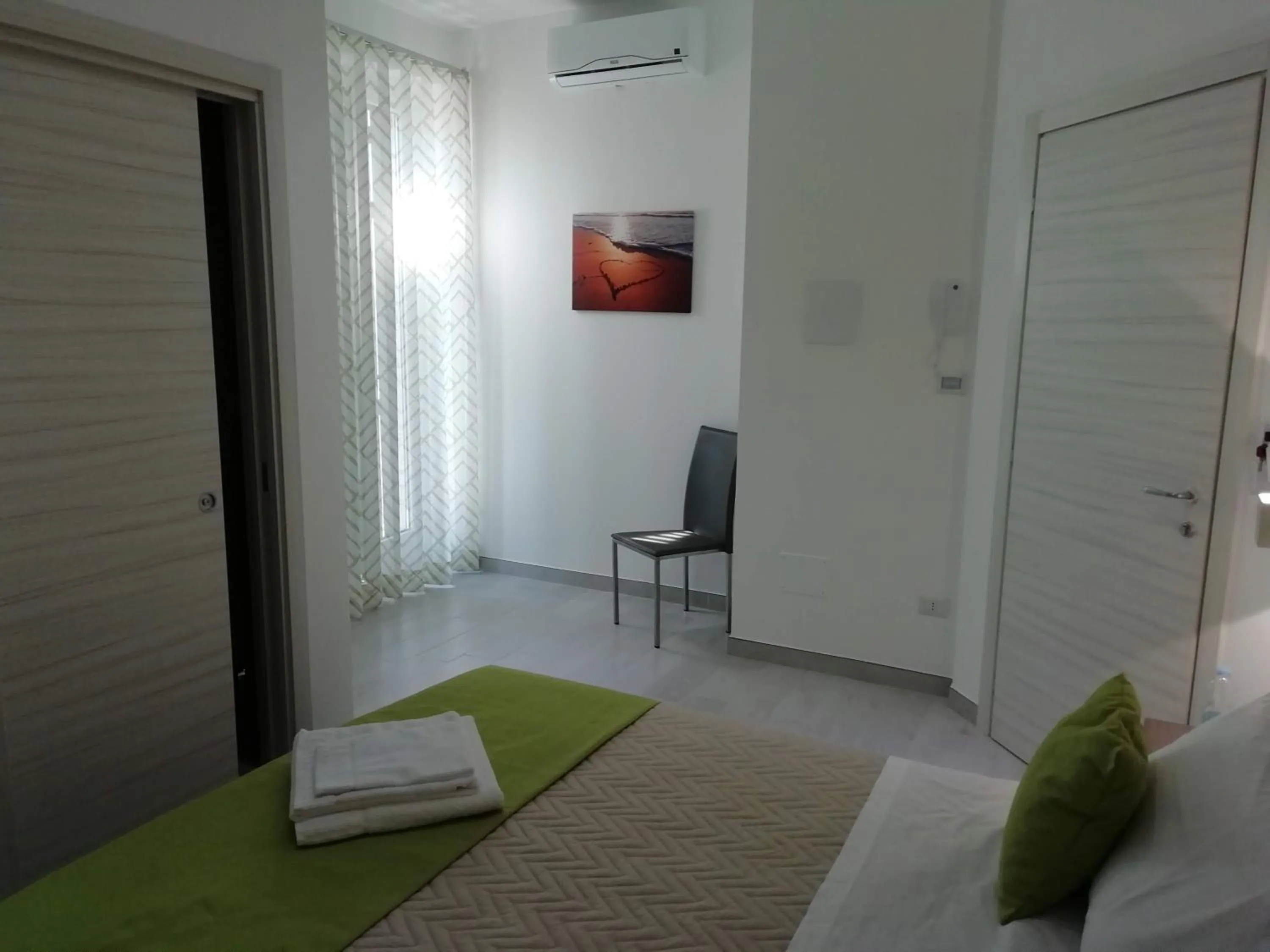 Bed in Flamingo Rooms