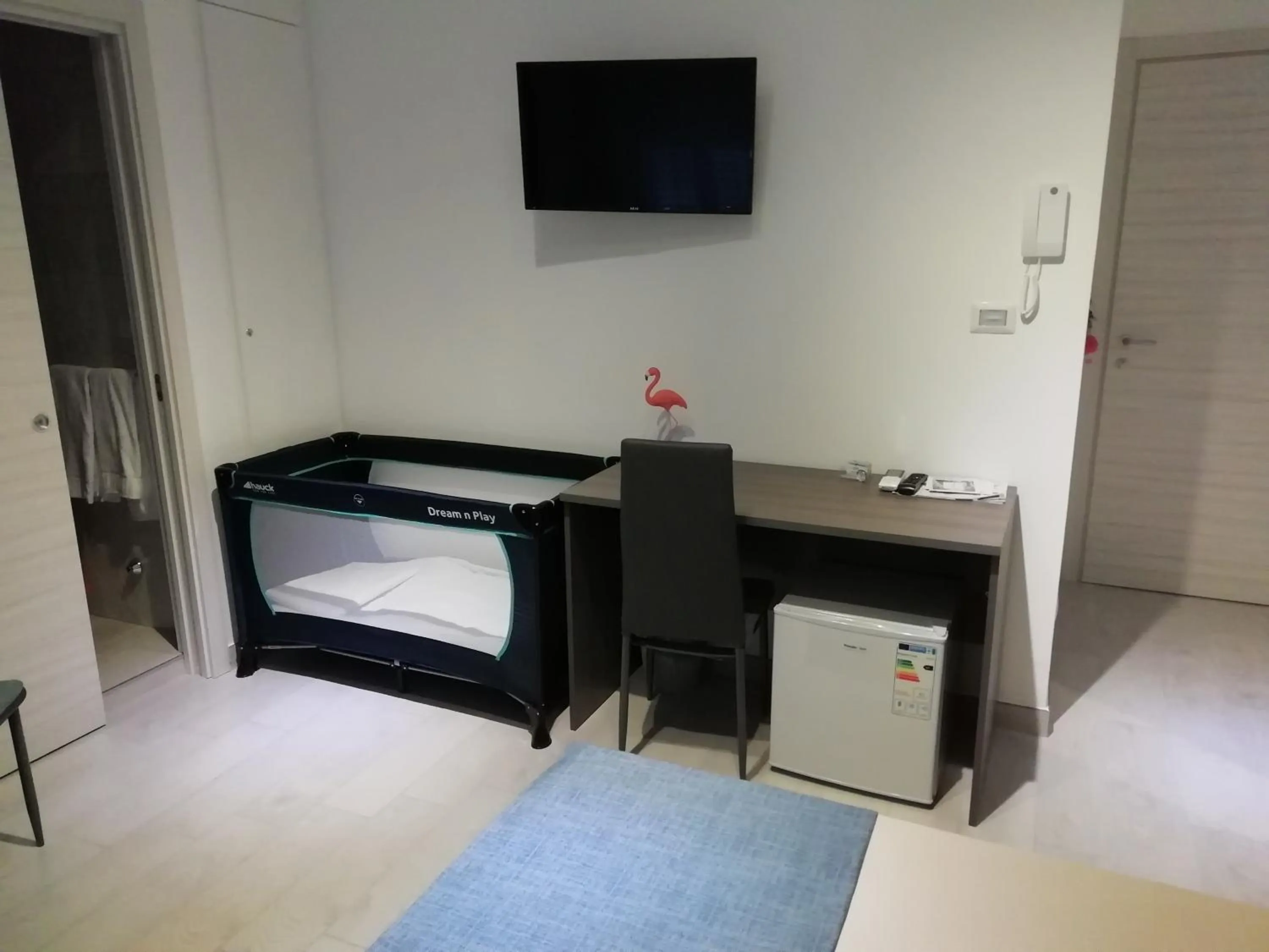 Bed in Flamingo Rooms