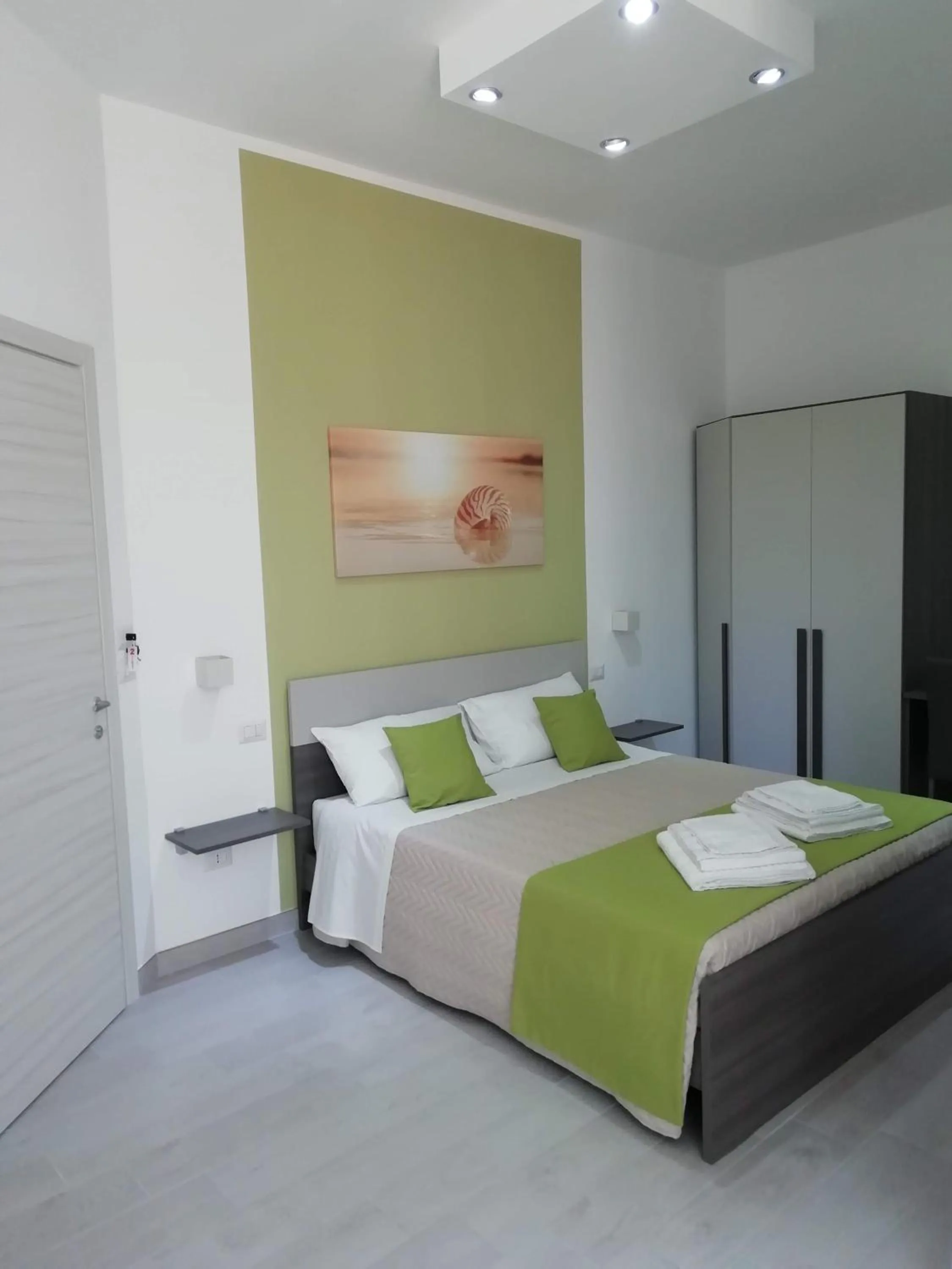 Bed in Flamingo Rooms