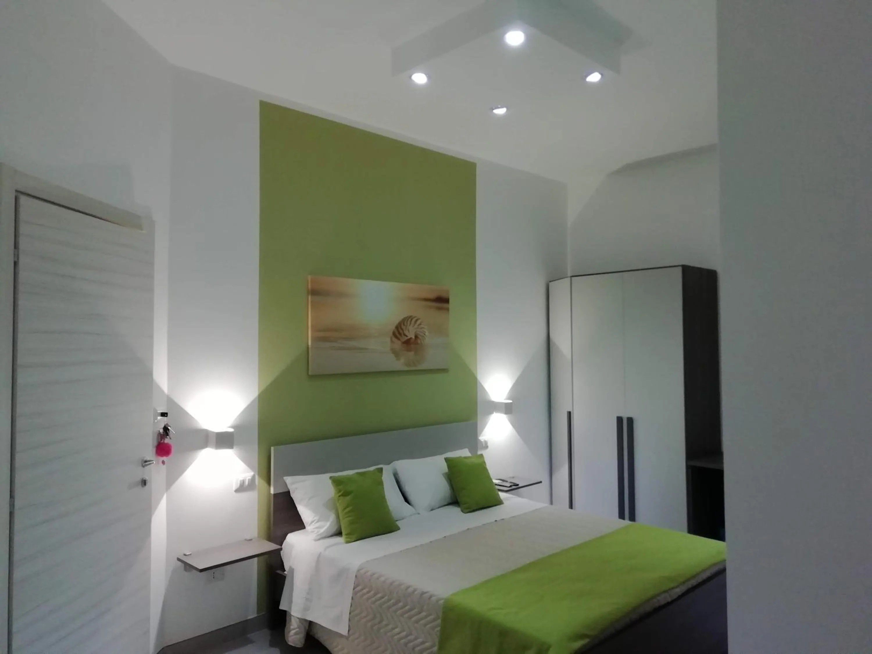 Bed in Flamingo Rooms