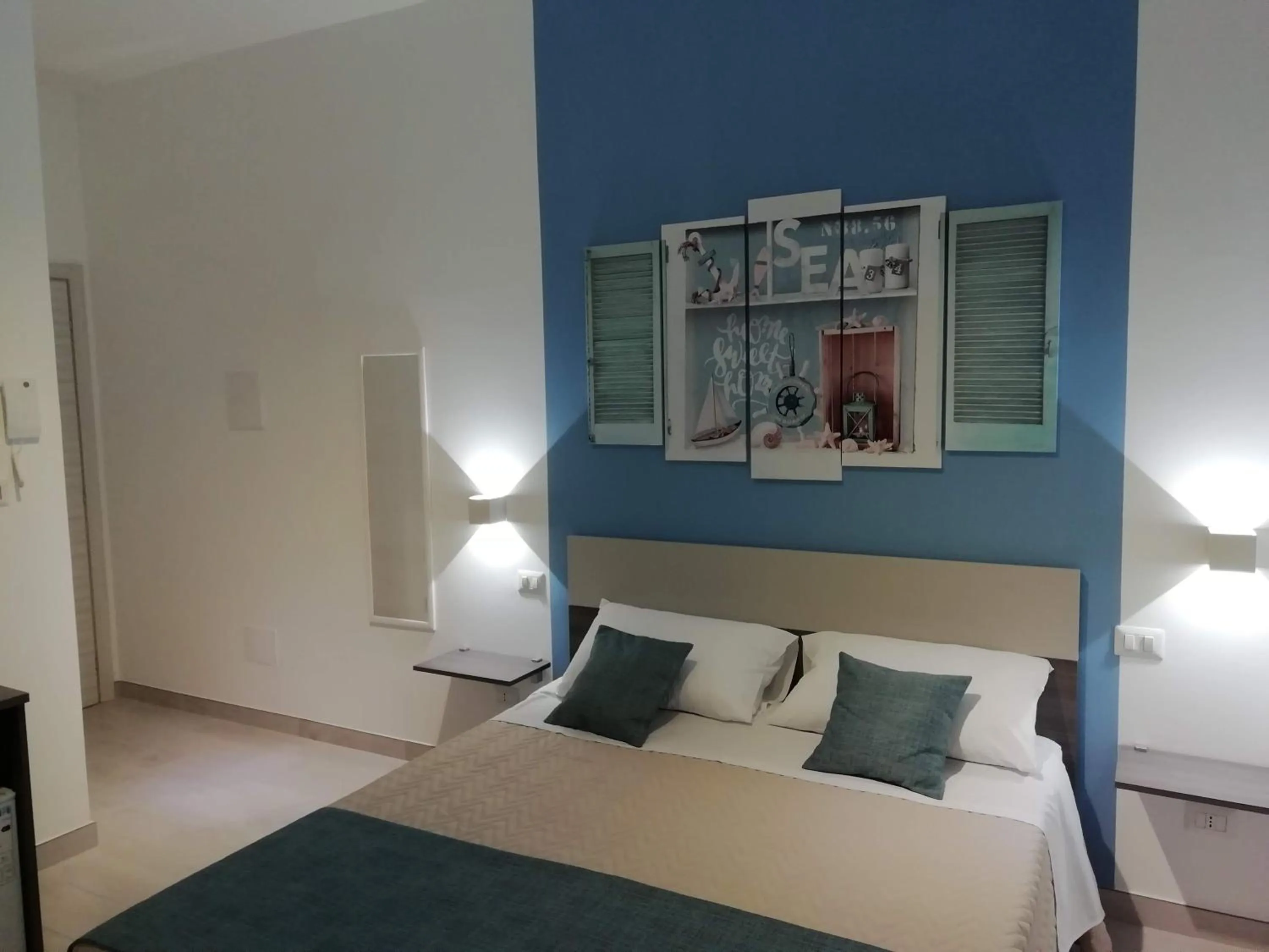 Bed in Flamingo Rooms